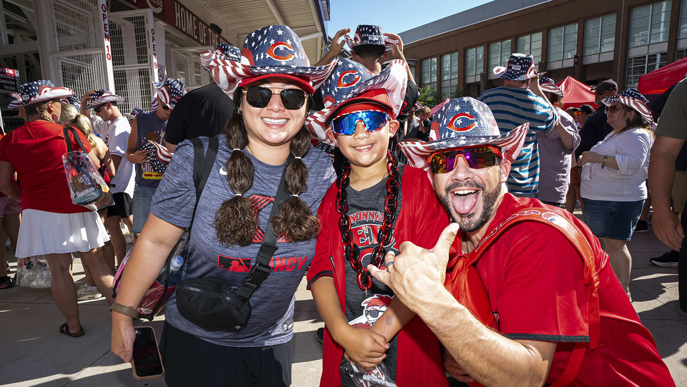 Reds fans wearing their USA-themed Cowboy hats at Fourth of July Reds game.