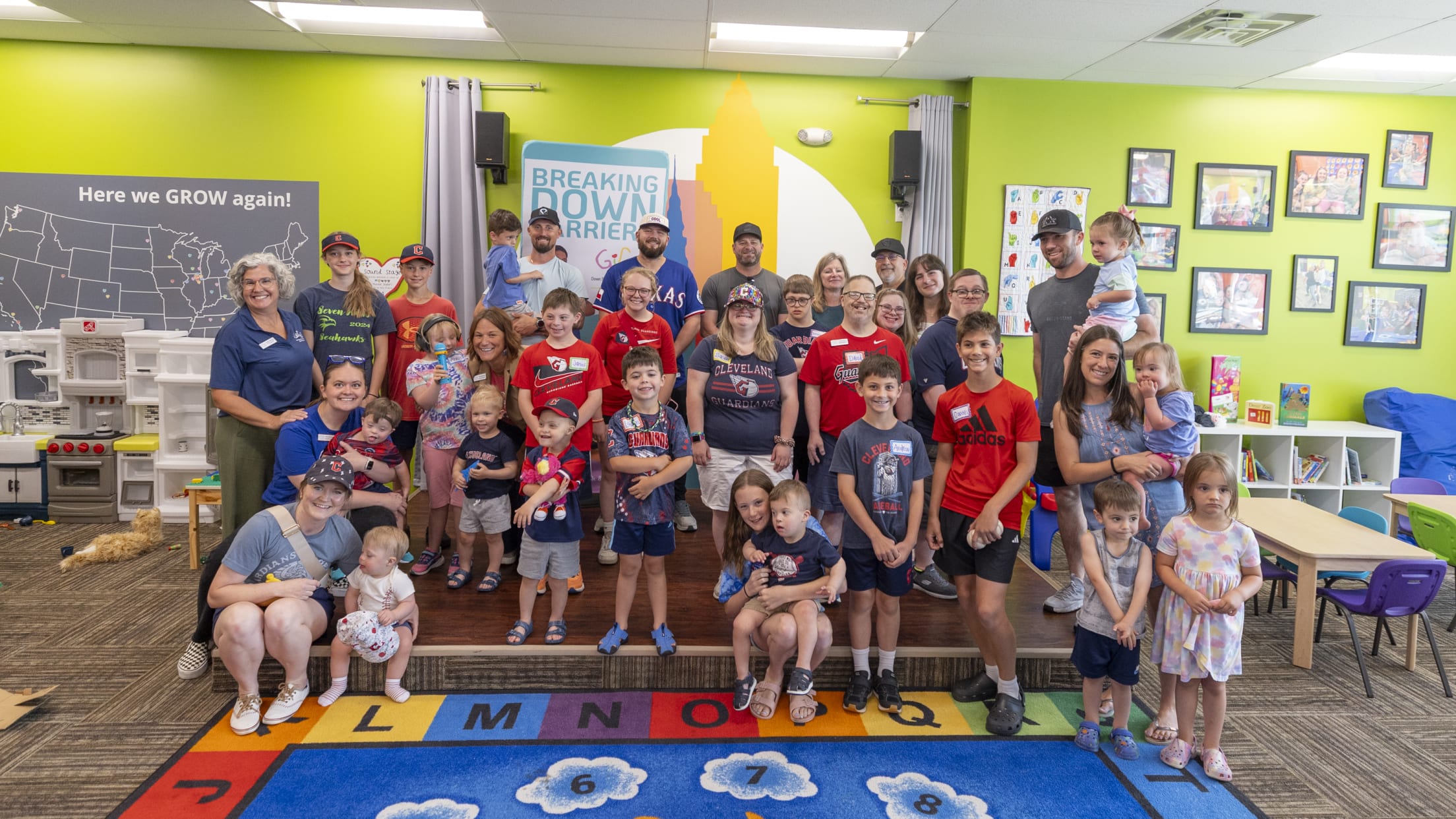 Jake Burger takes a group picture at Gigi's Playhouse.