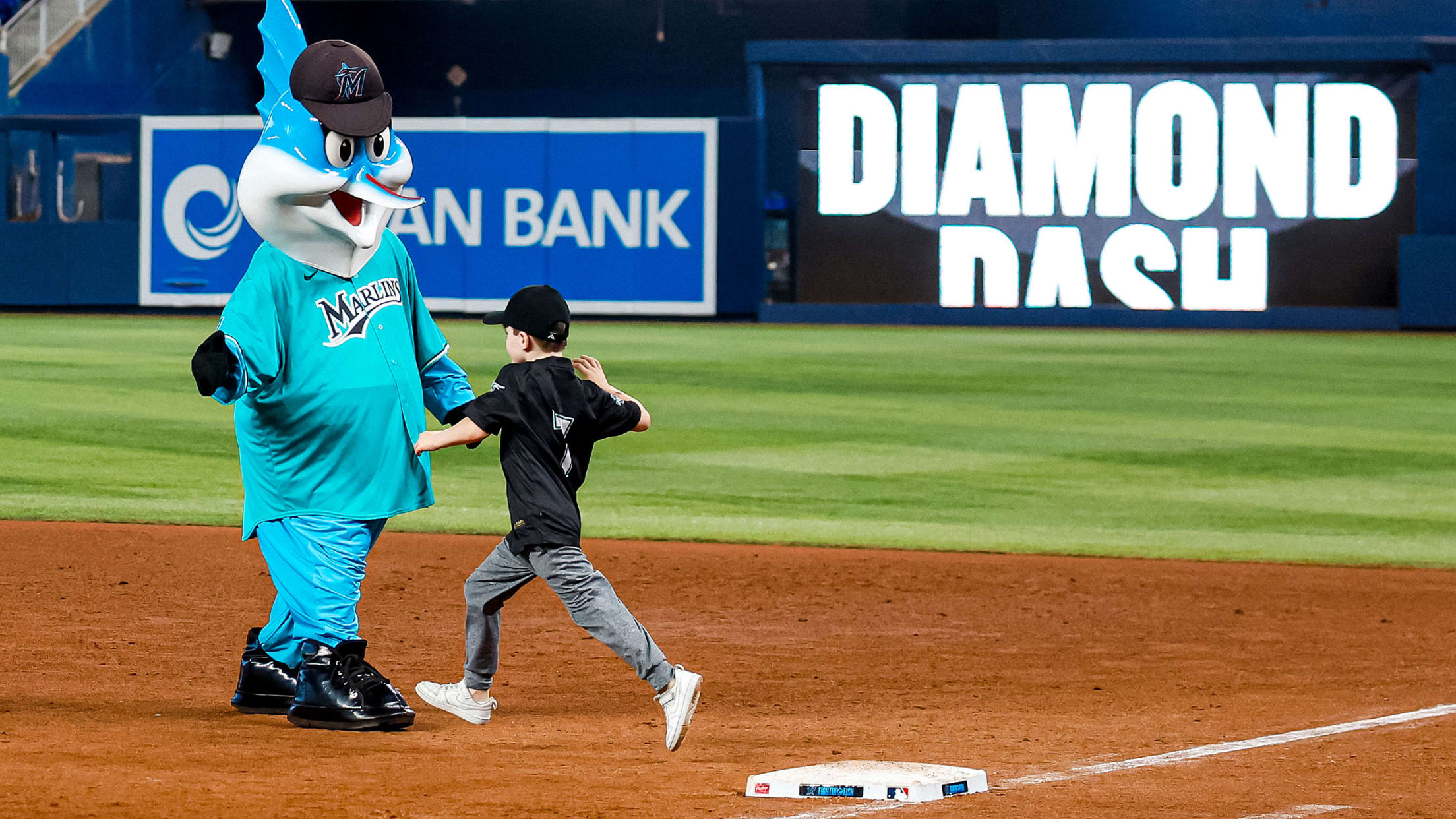 Young fan high fiving Billy The Marlin