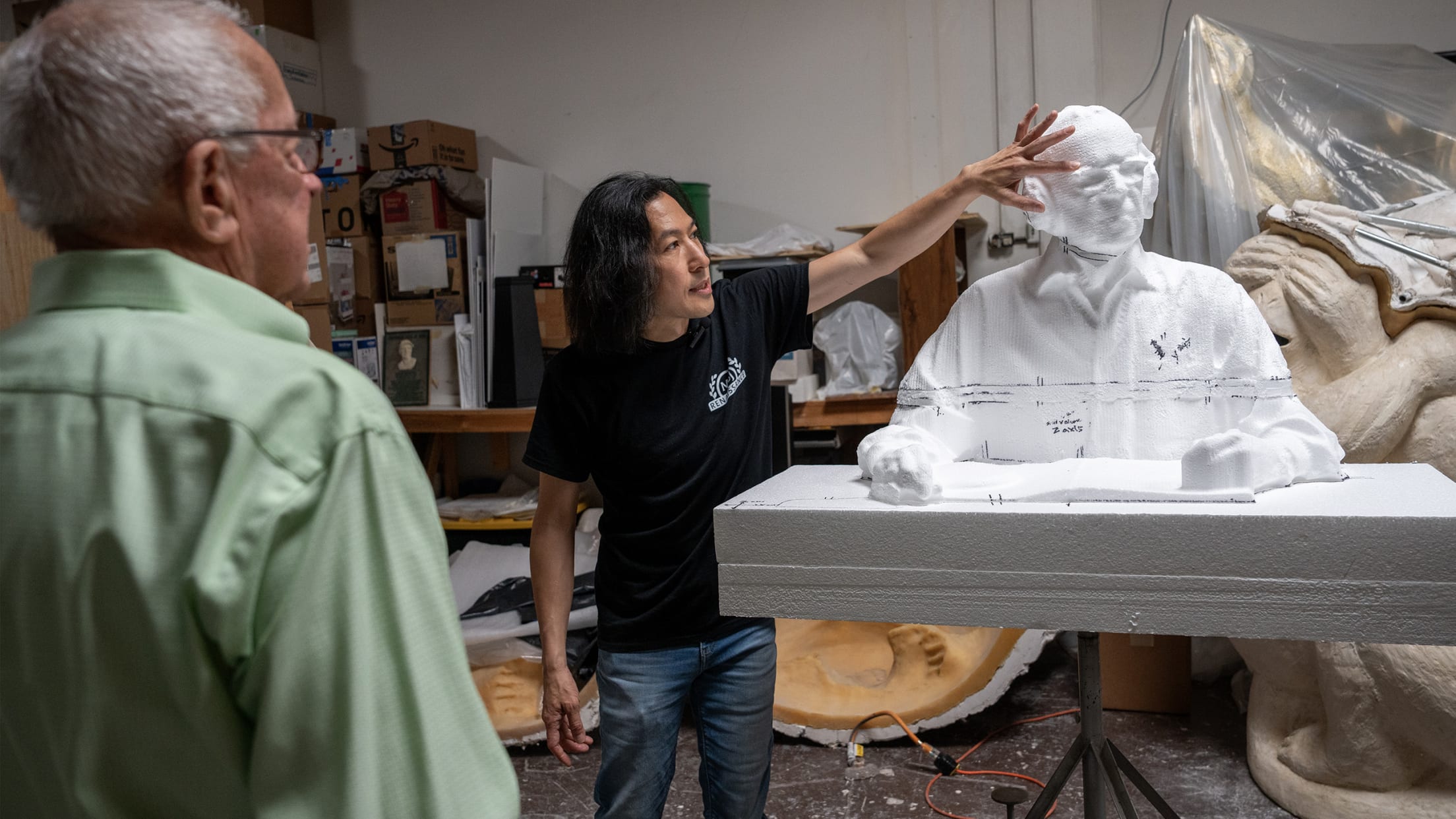 Sculptor Tom Tsuchiya presenting progress on the statue while in construction.