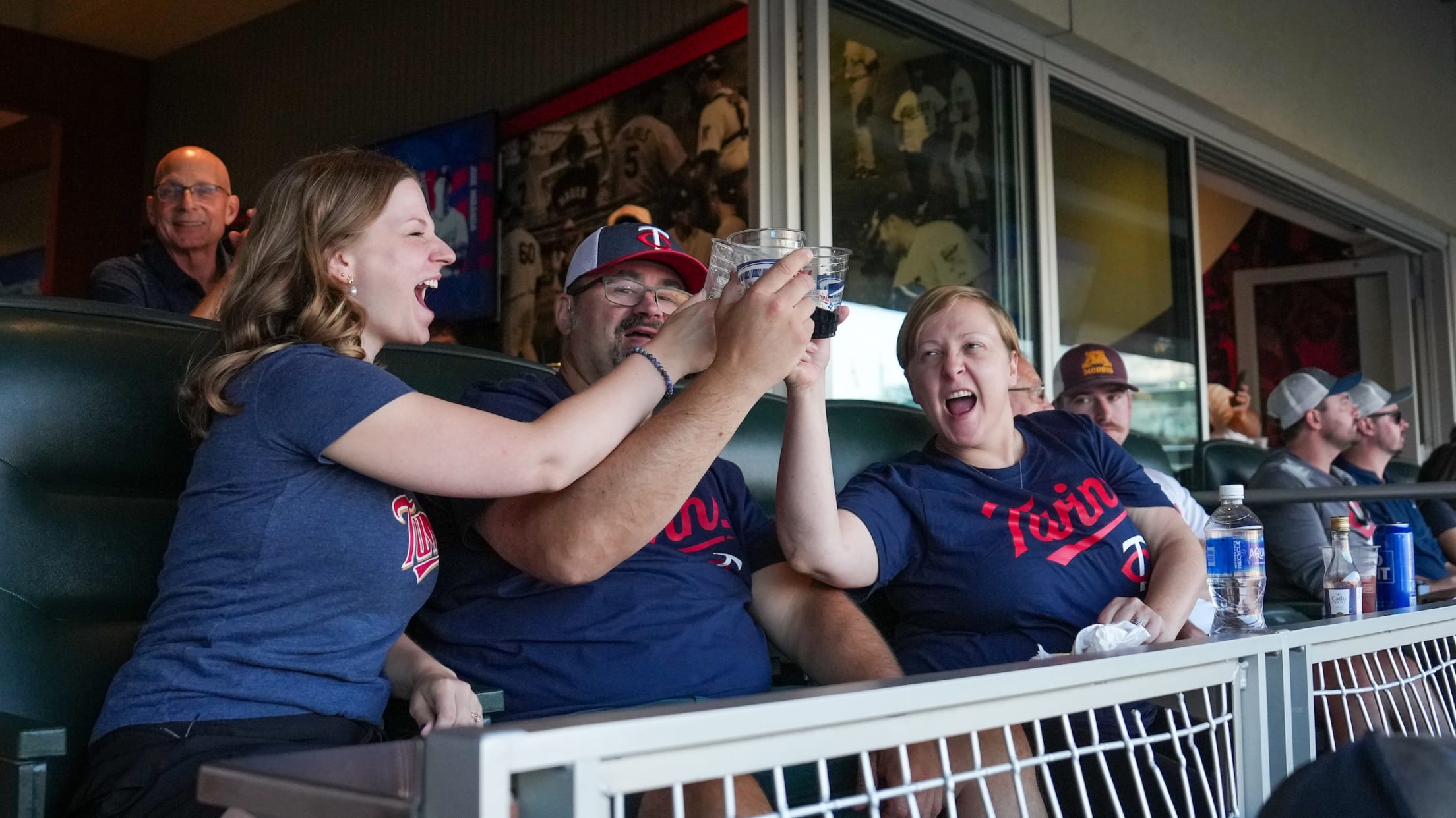 Fans celebrating a big play in a suite at Target Field