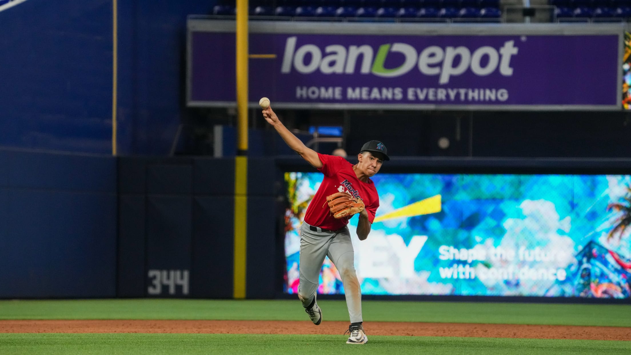 The infielder throws the ball toward first base.