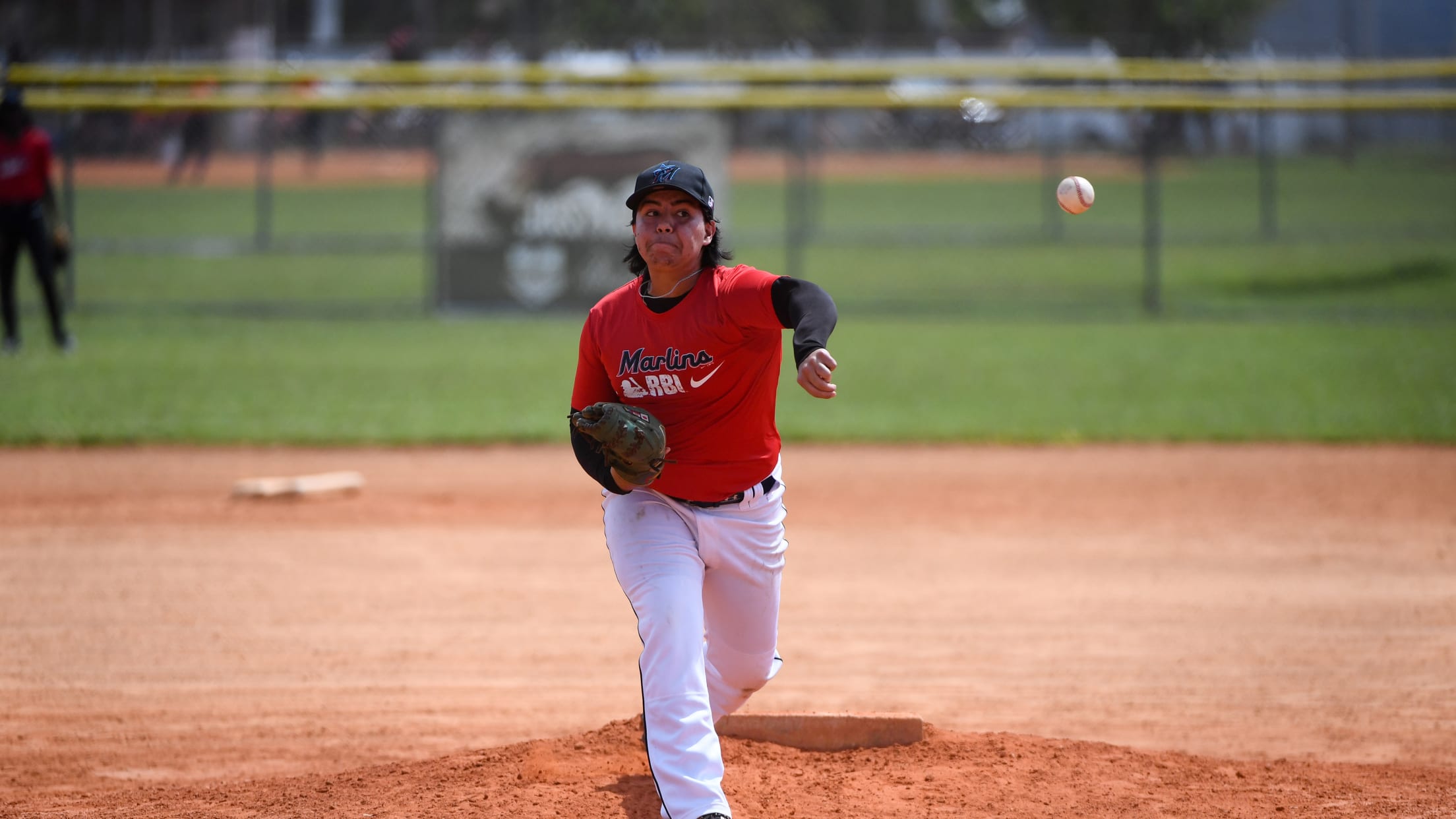 A player pitches on the hill during Nike RBI Opening Day.
