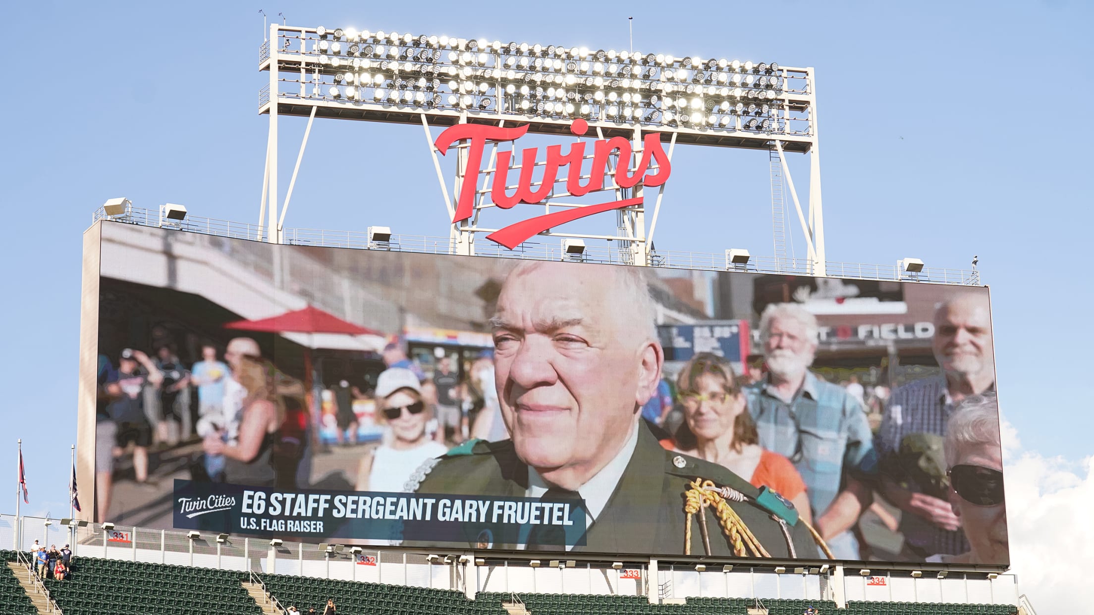 Minnesota Twins scoreboard at Target Field featuring a game's U.S. Flag Raiser