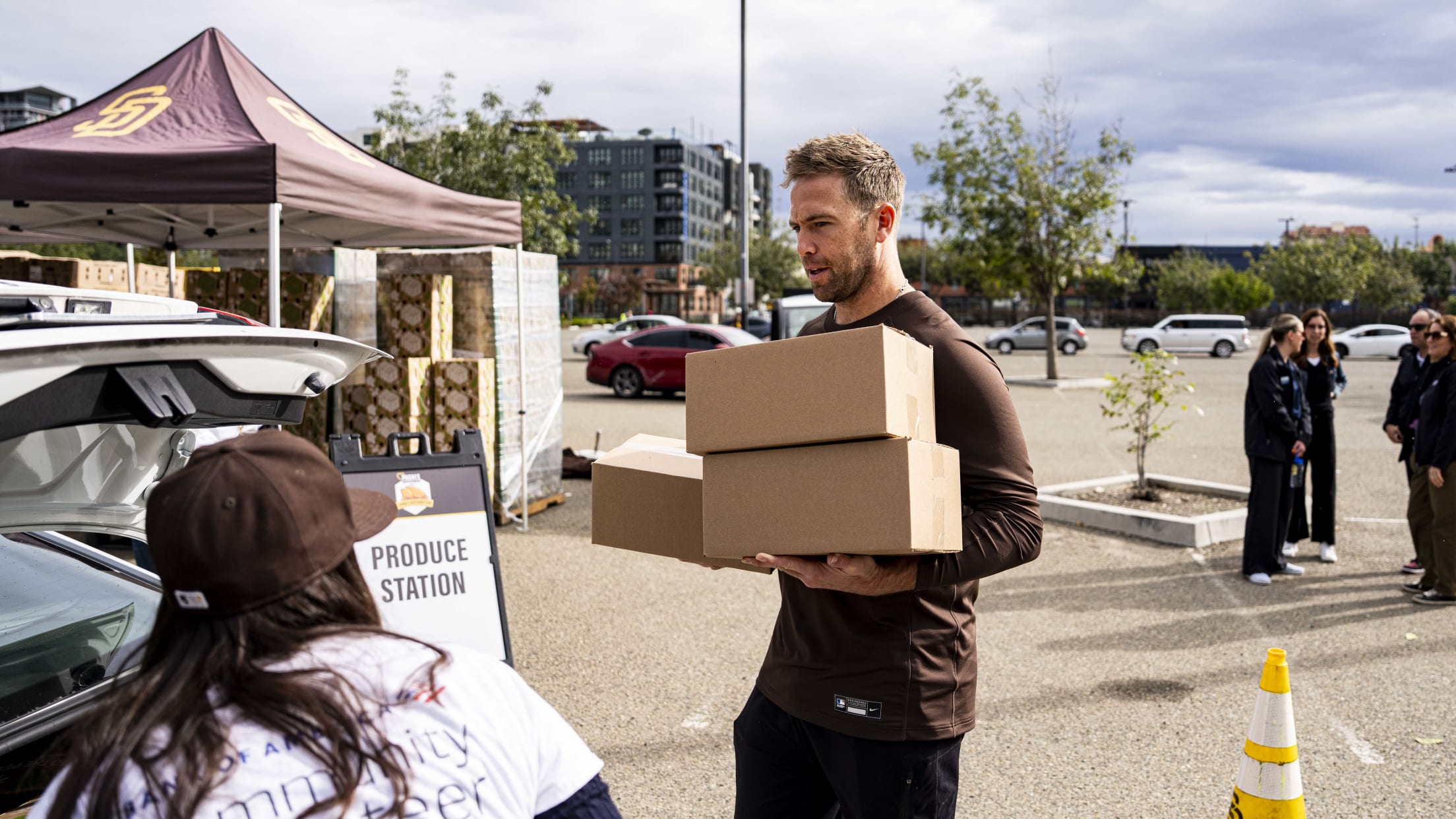 Jason Adam participates in a turkey distribution ahead of Thanksgiving,