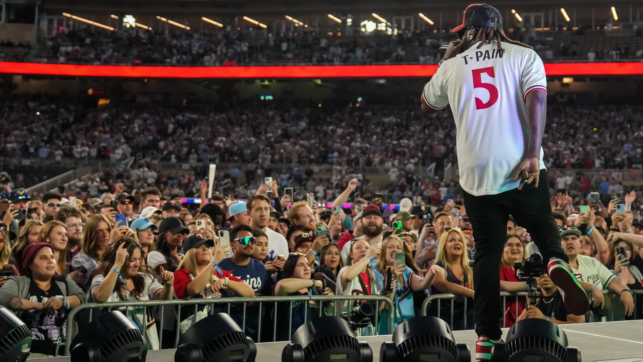 T-Pain performing at Target Field with fans having on-field access