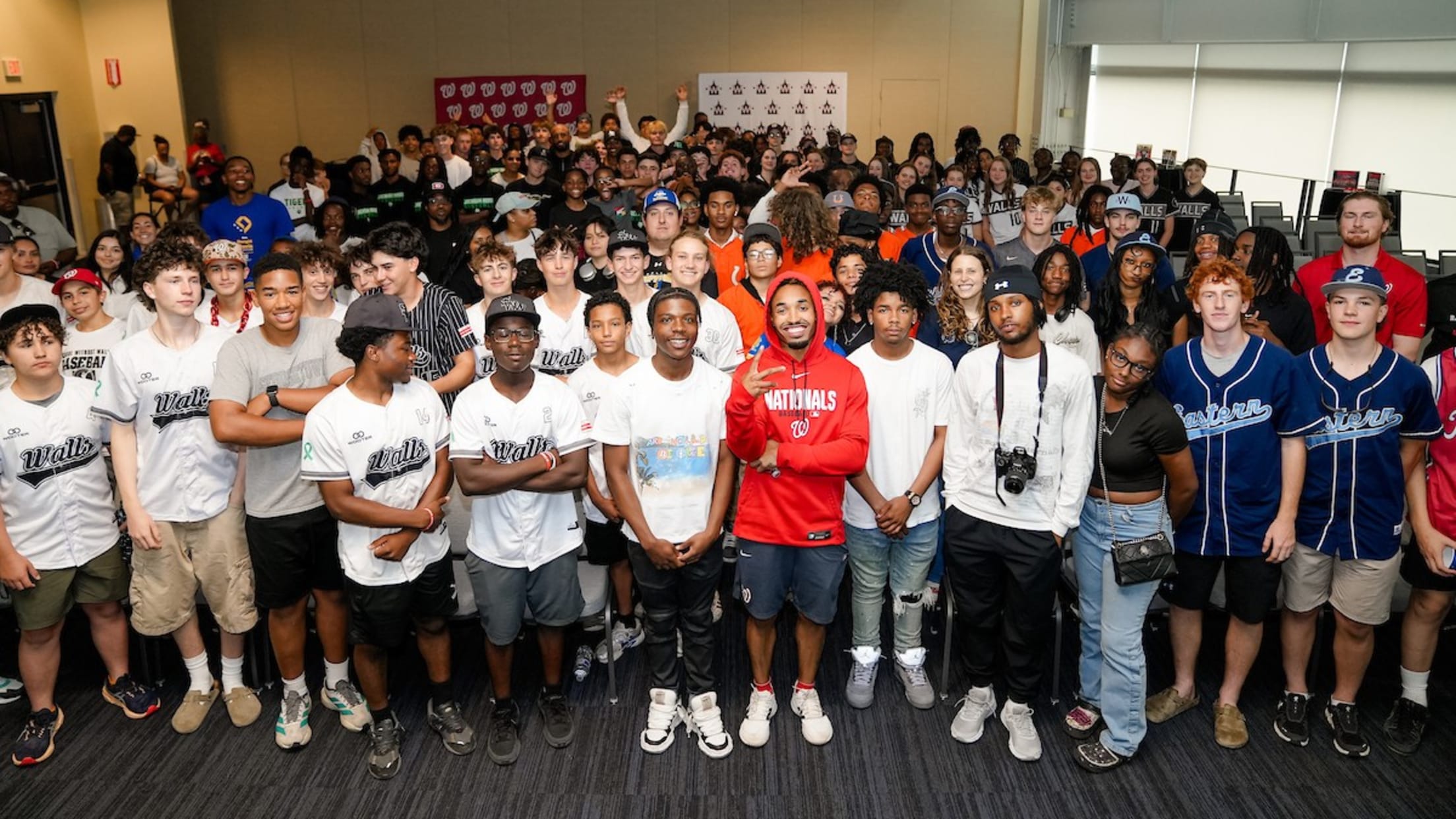 Nasim Nuñez takes a group photo with young adults from the District of Columbia Interscholastic Athletic Association (DCIAA).