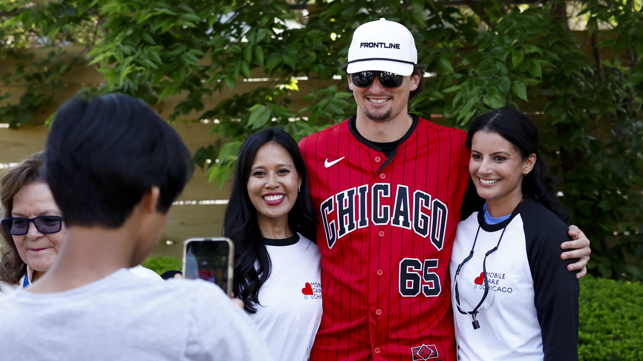 Davis Martin poses for a picture with volunteers.