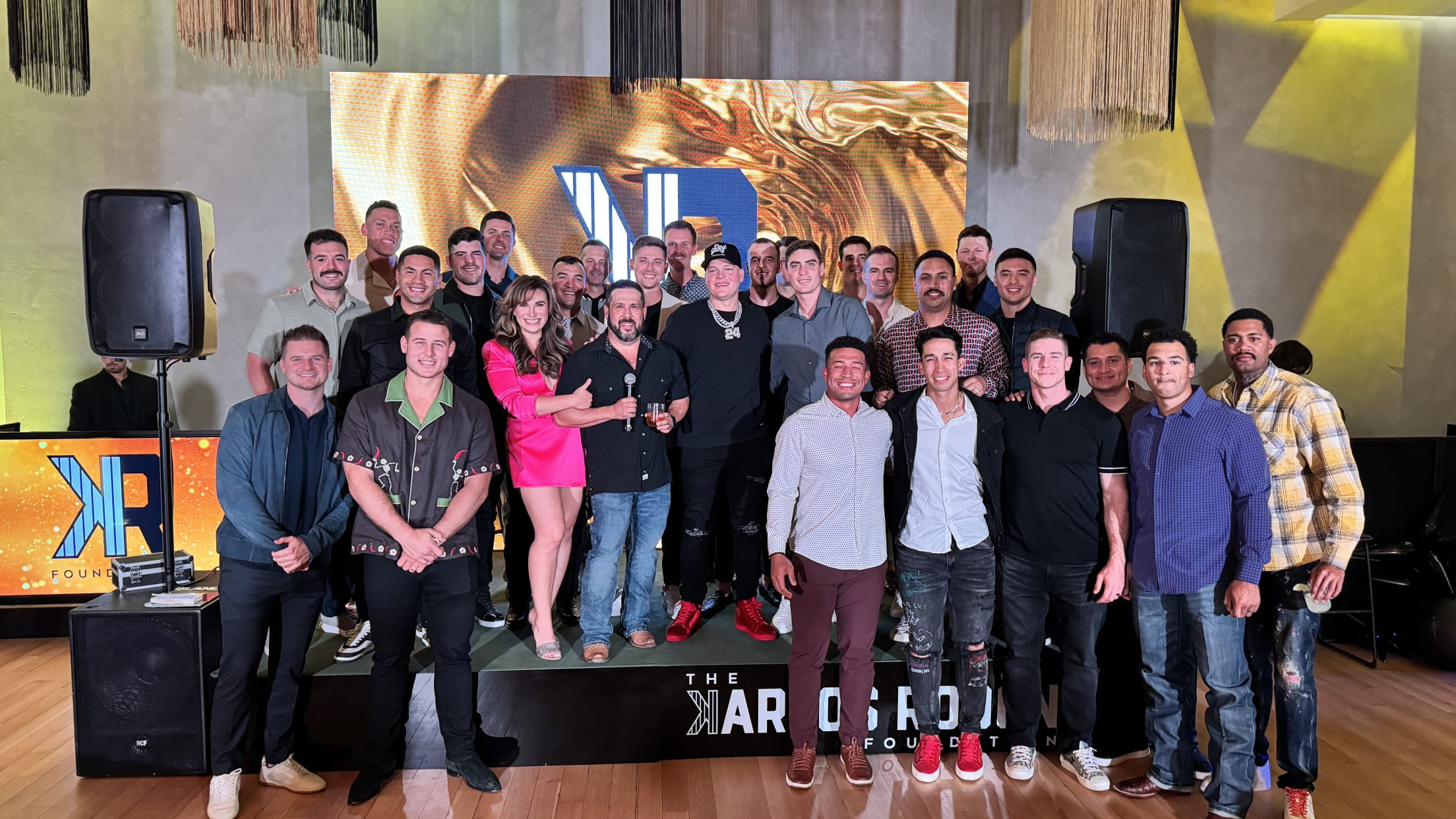 Members of the New York Yankees and others pose for a group photo during a Carlos Rodón Foundation event.
