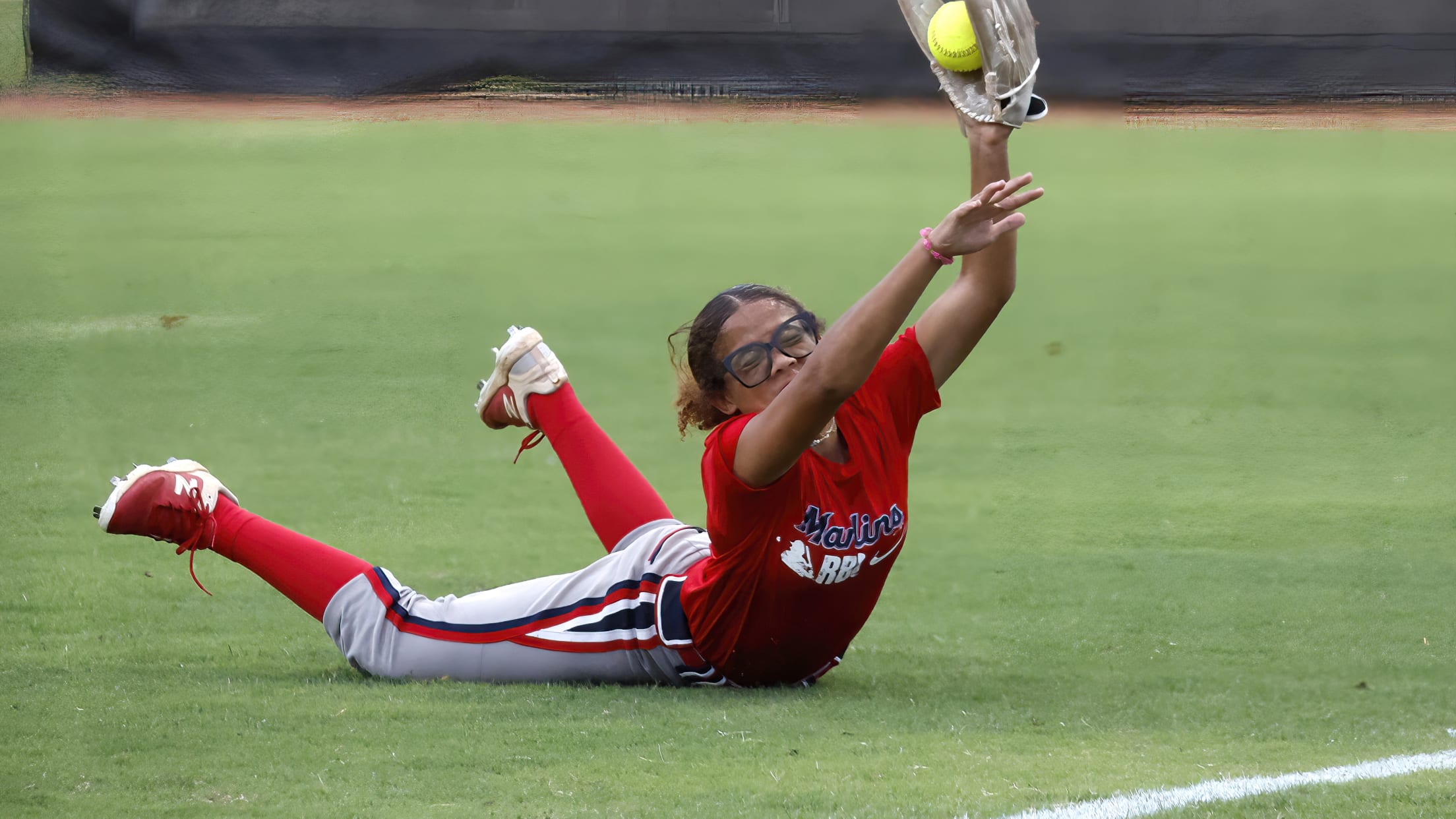 A player makes a diving catch.