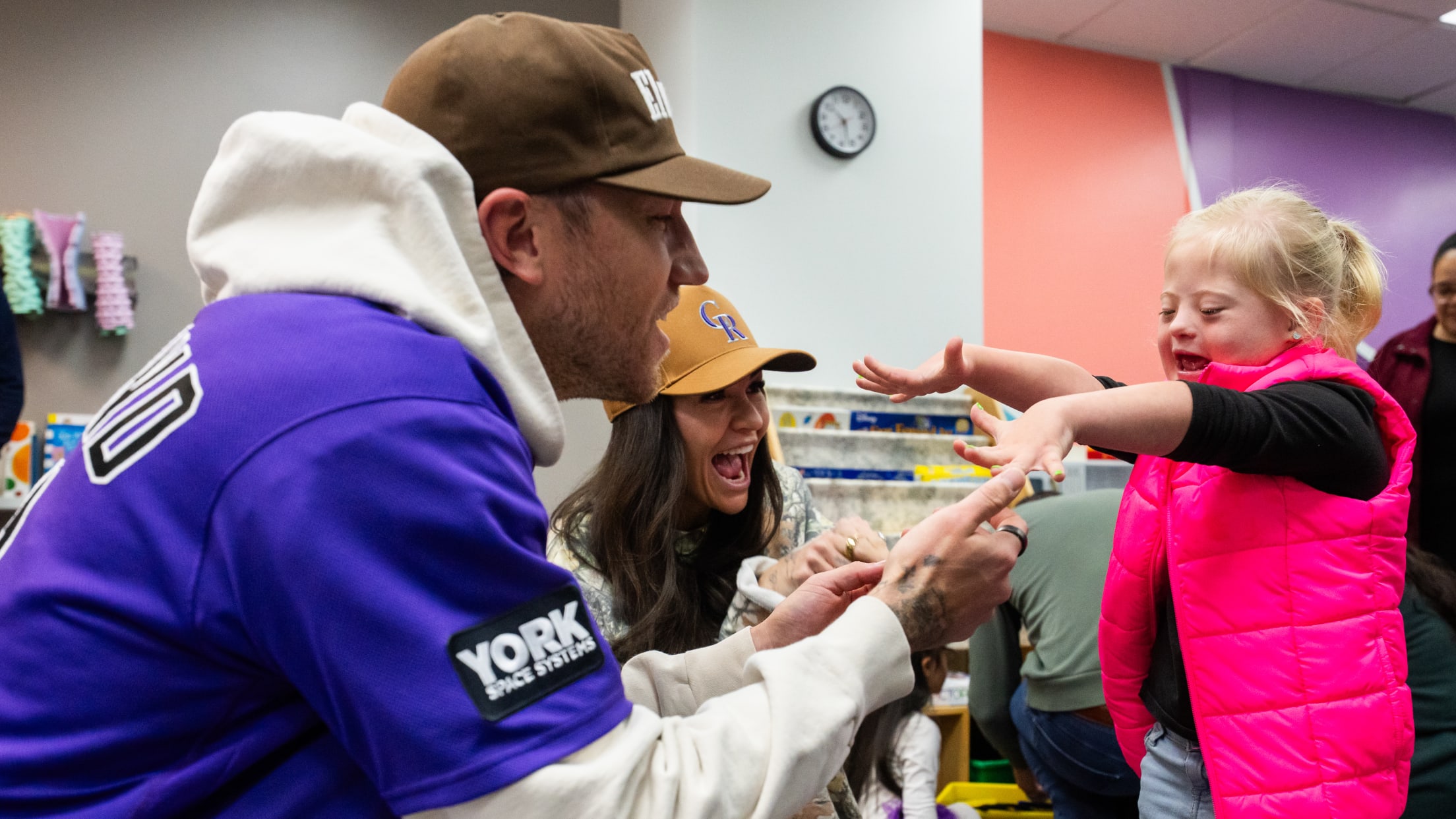 Kyle Freeland plays with a child at Gigi's Playhouse.