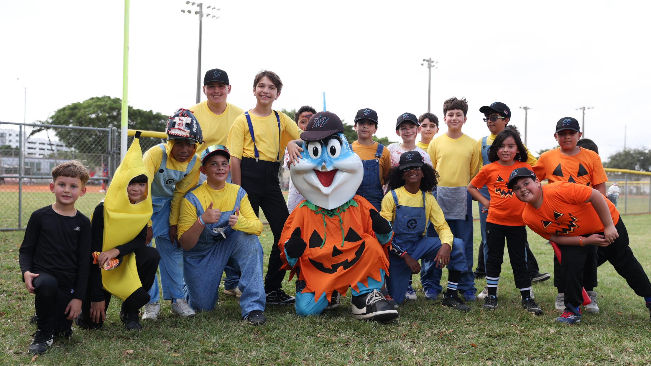 Billy the Marlin and players pose for a group photo in their costumes at the Halloween Spooktacular.