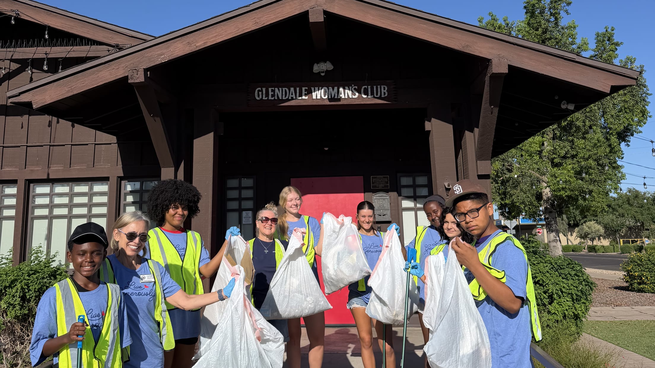 Volunteers pick up trash outside Glendale Woman's Club.