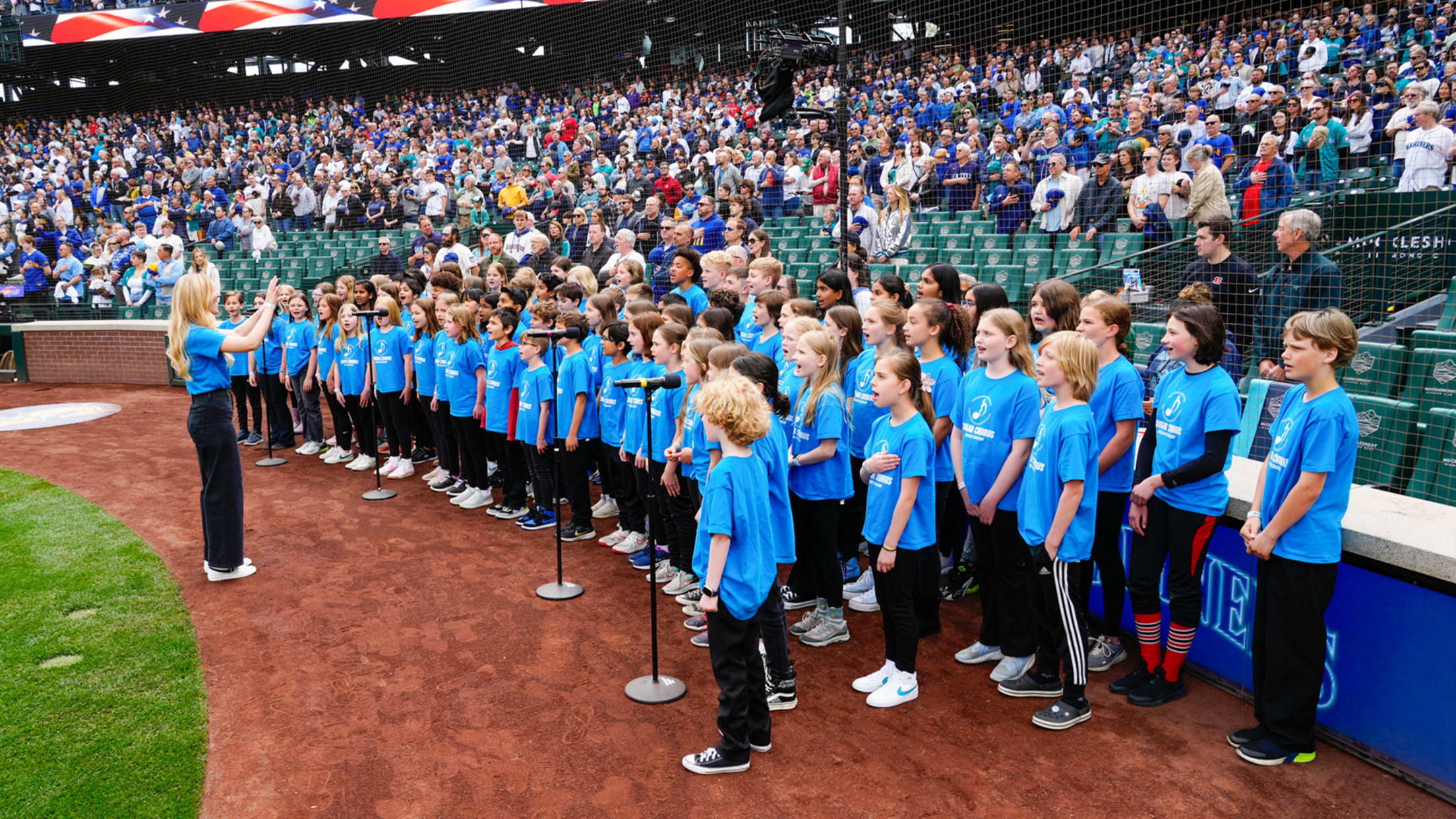 Image of kids singing National Anthem at T-Mobile Park.