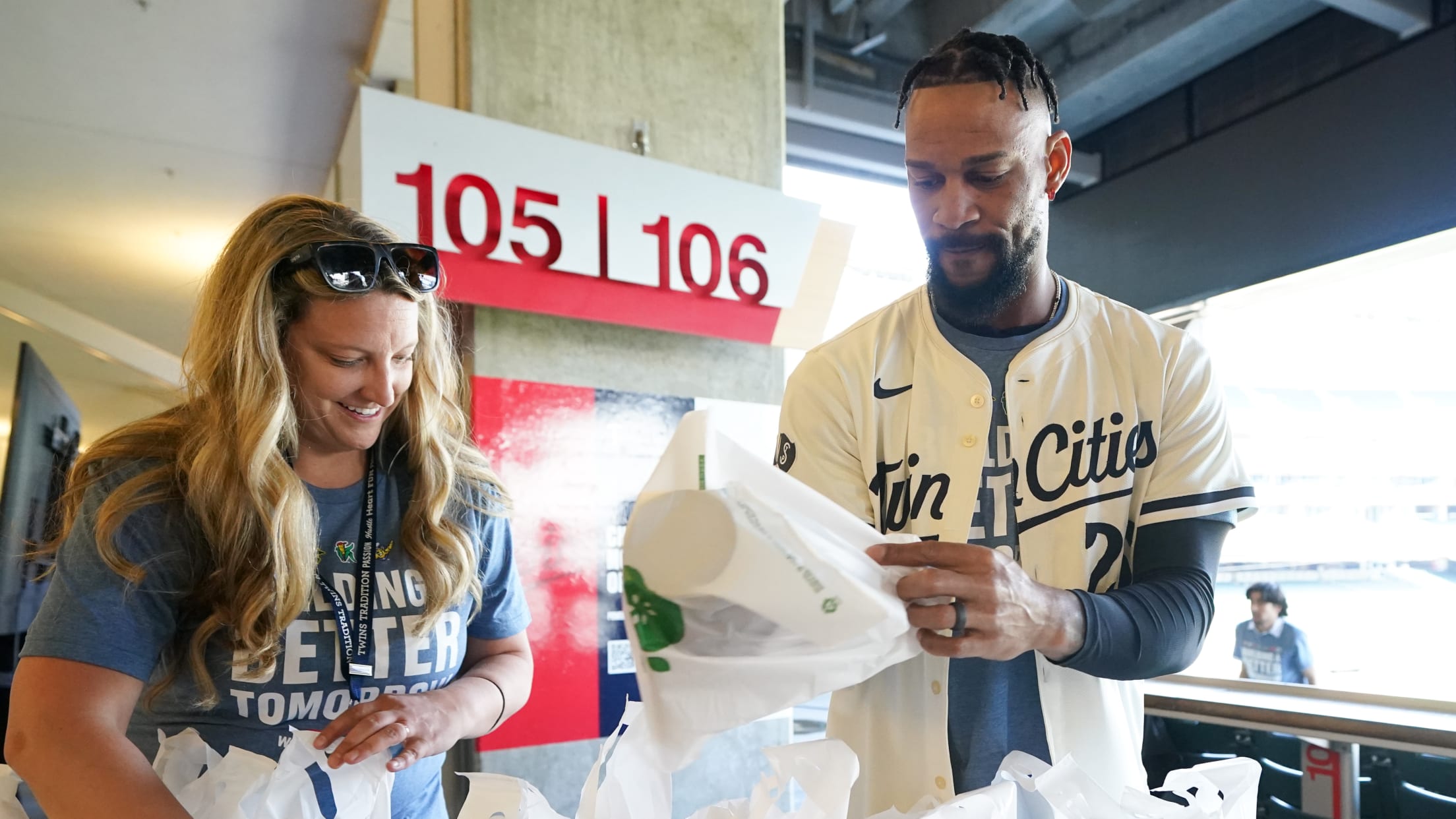 Twins employee and Byron Buxton at a Minnesota Twins Week of Service event