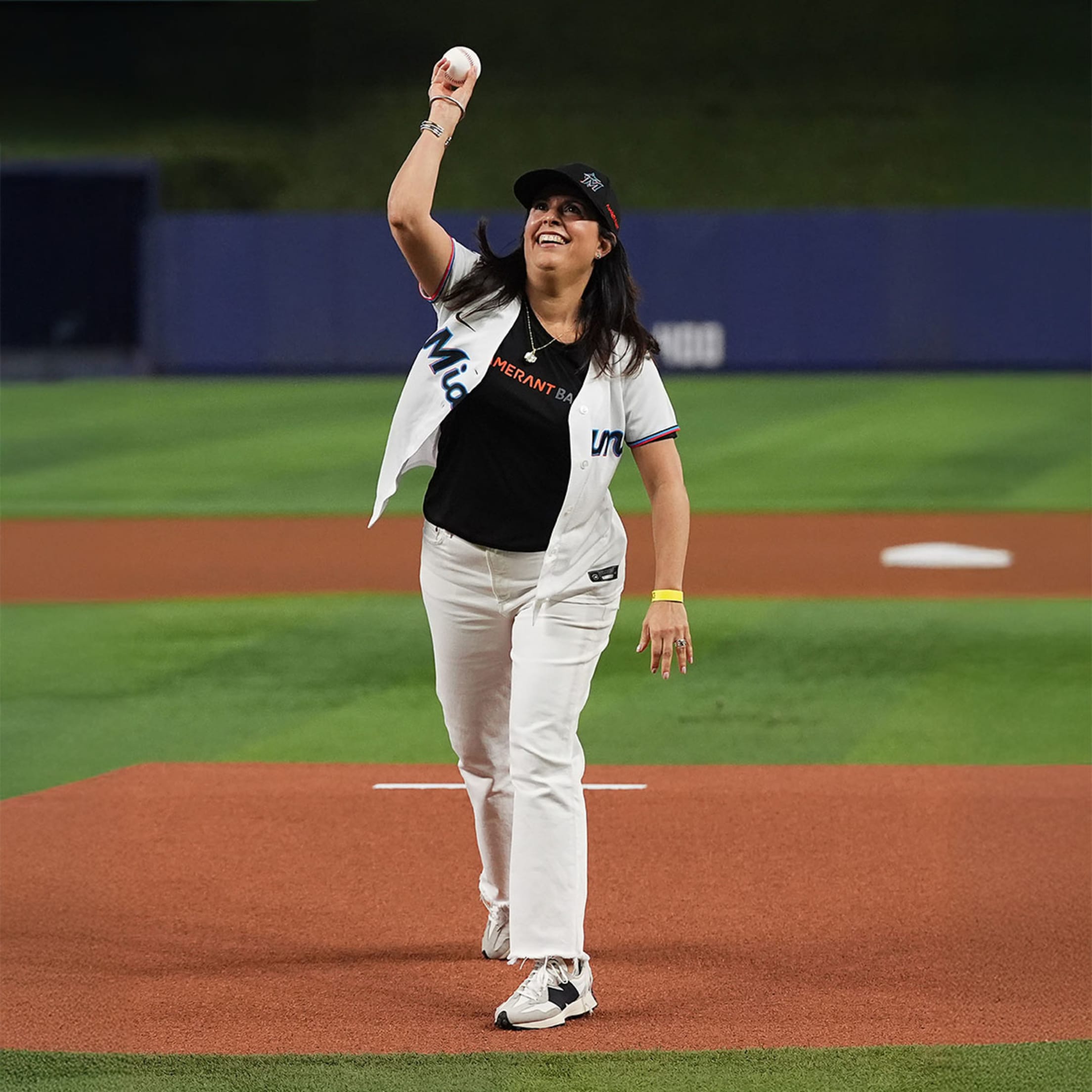Fan throwing out the first pitch at a Marlins game