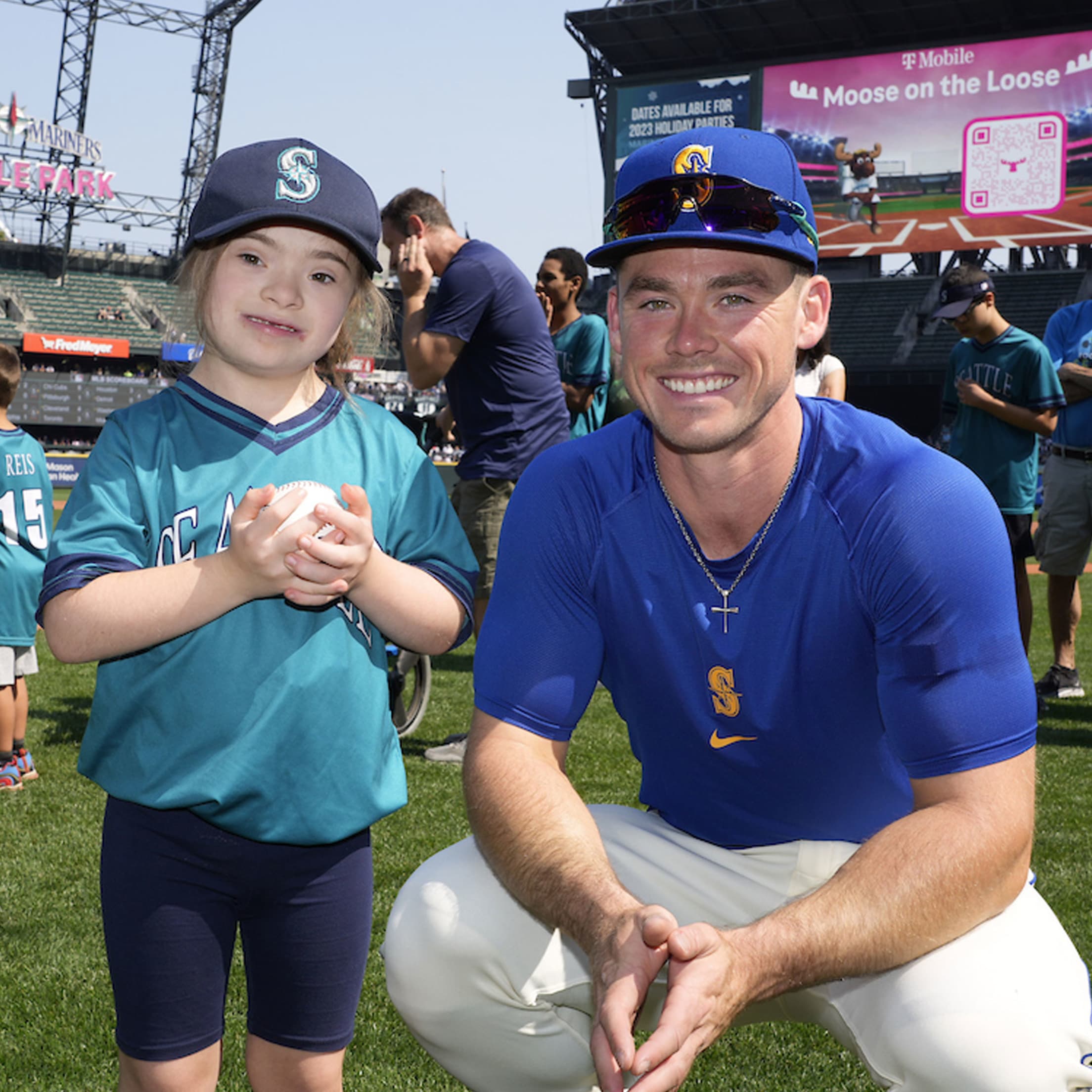Cade Marlowe taking photo with a fan.