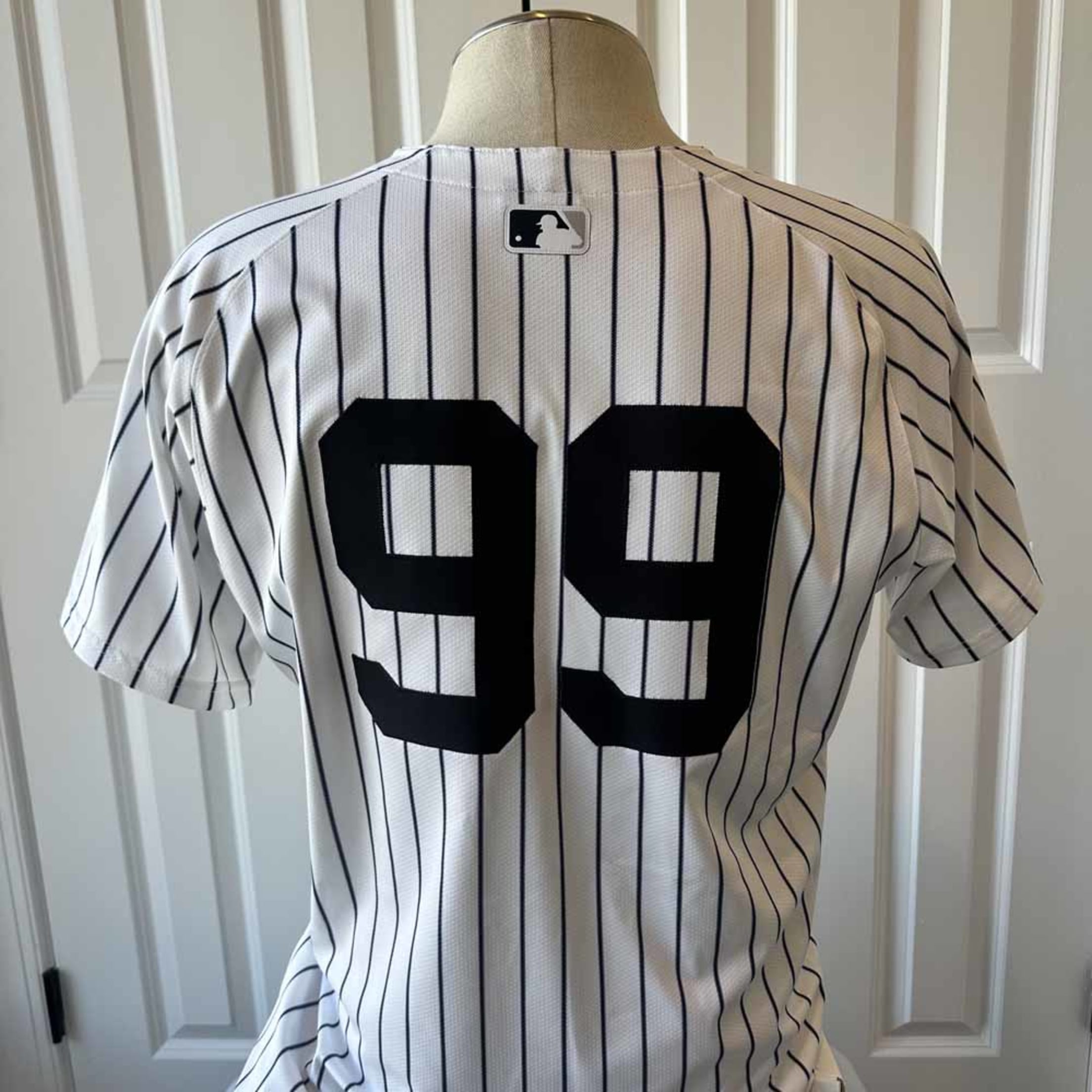 Aaron Judge home pinstripe jersey.