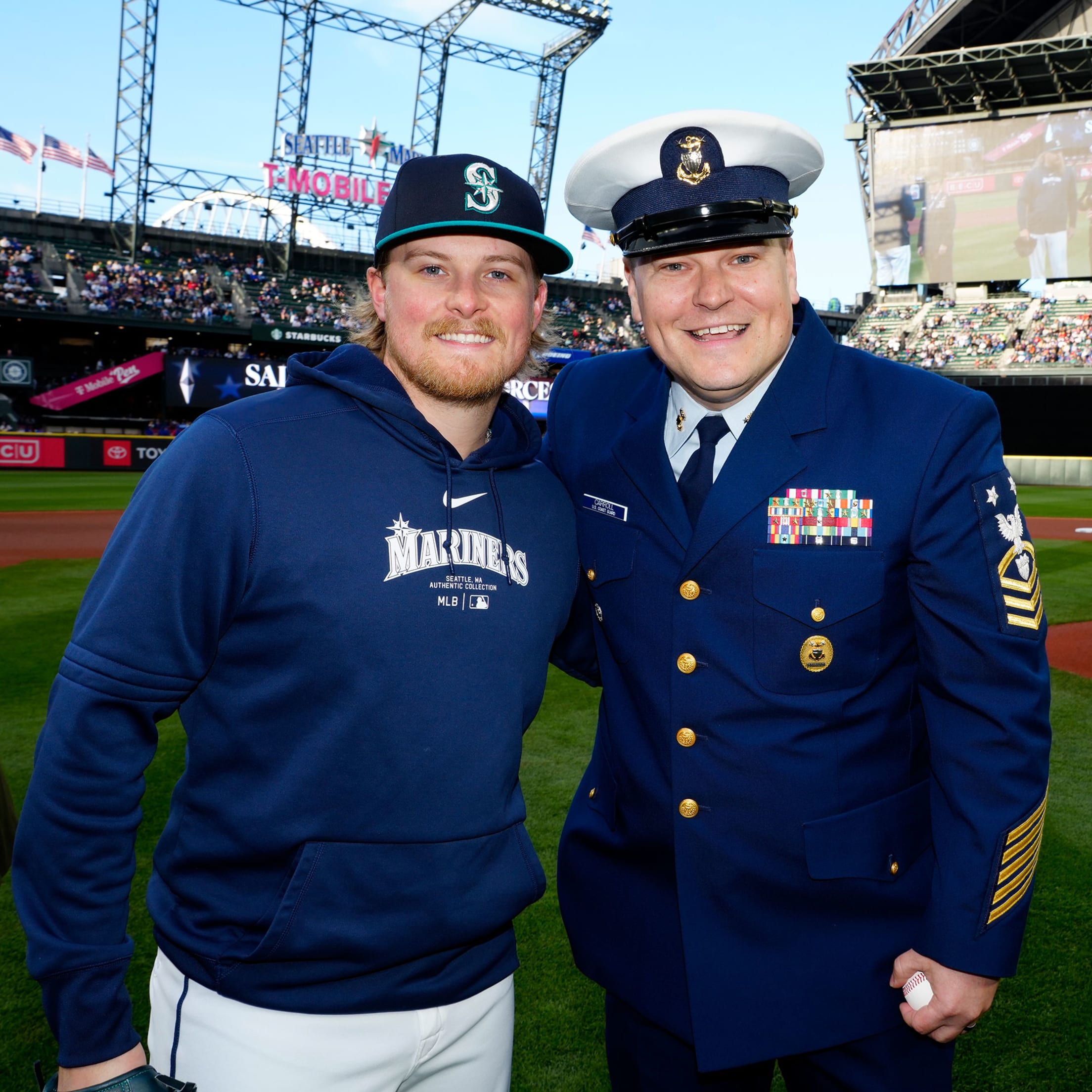 Gabe Speier taking picture with member of the Armed Forces.