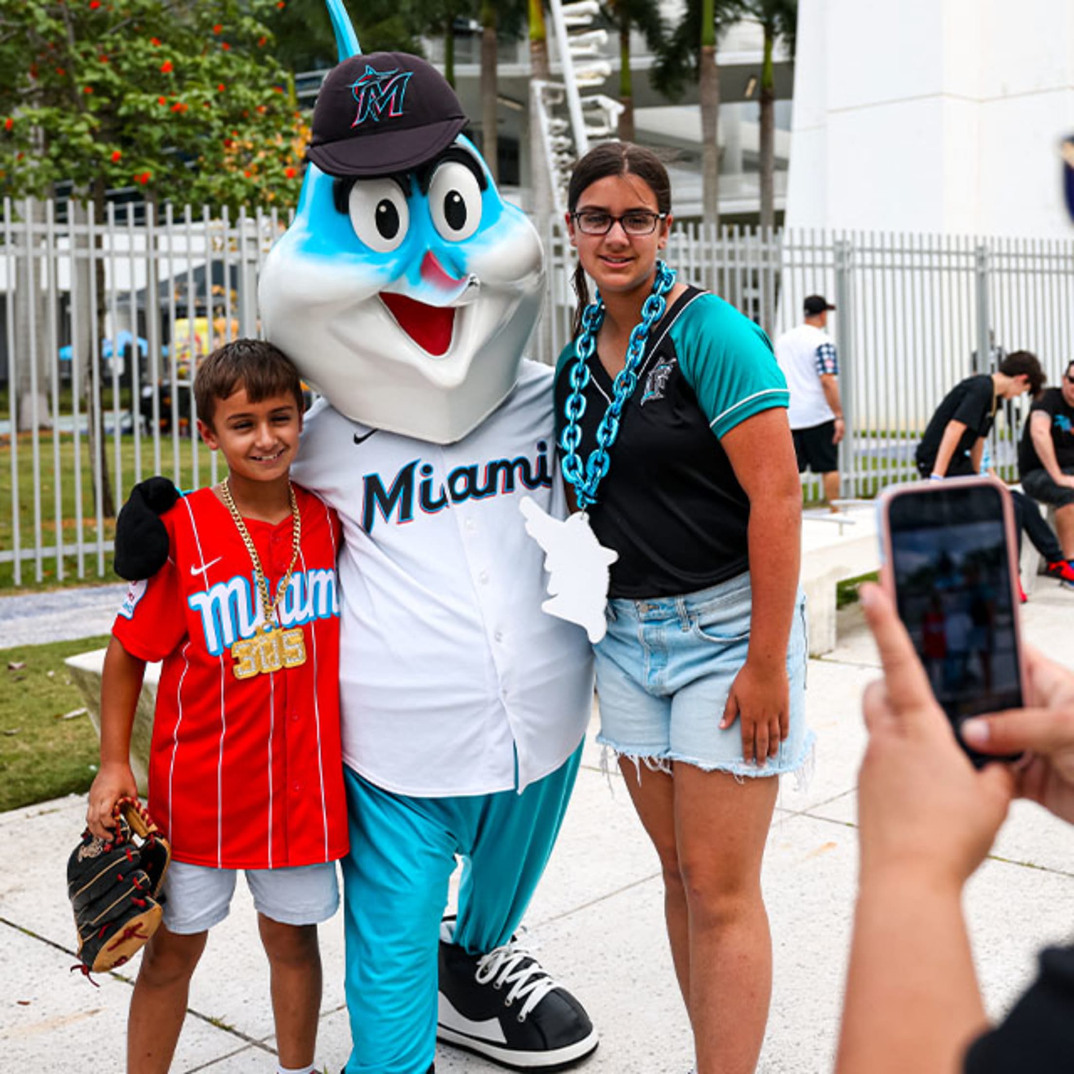 Billy the Marlin takes a photo with fans
