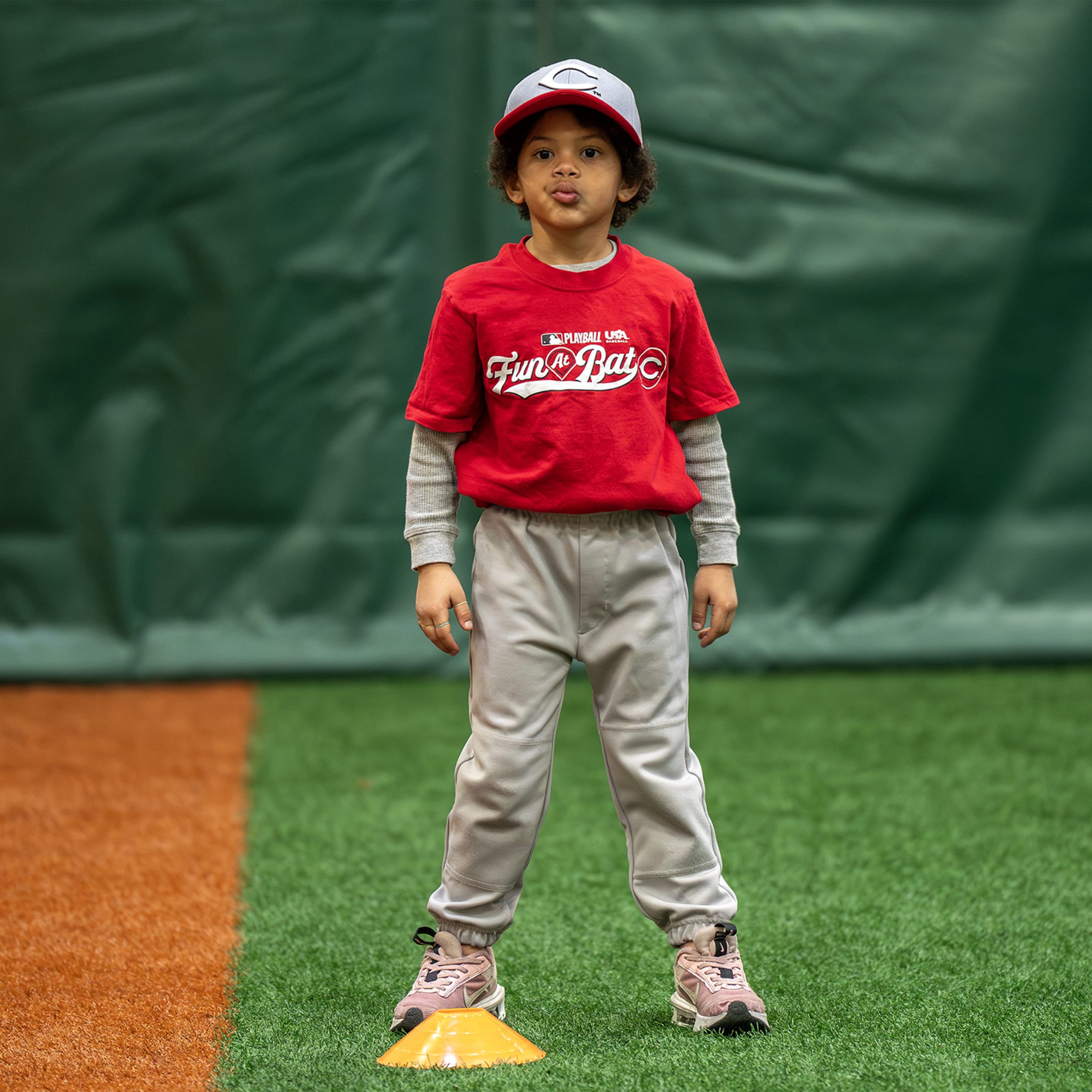 Fun At Bat participant stands by cone awaiting further instruction.