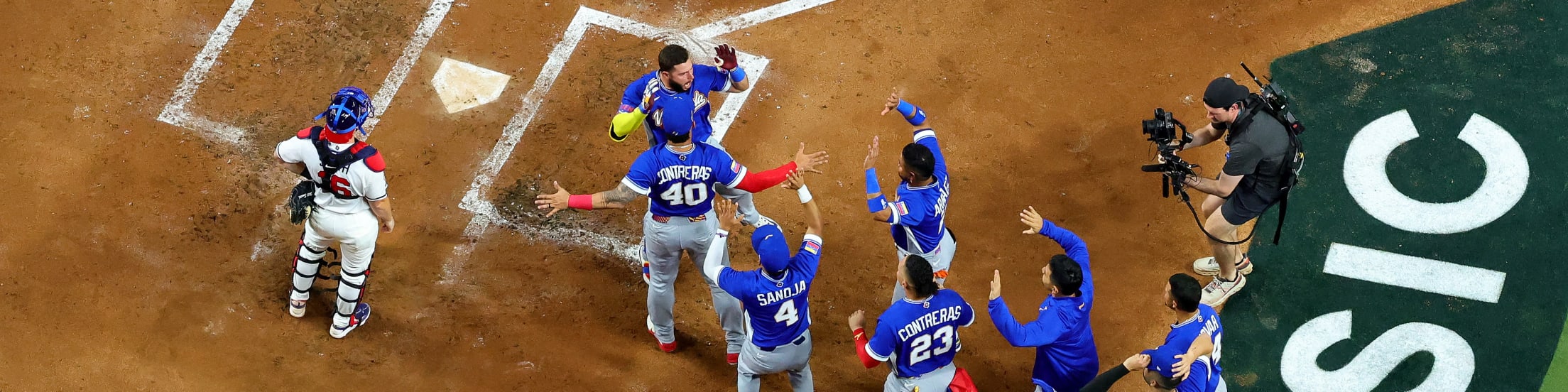 An aerial view of Team Venezuela celebrating a home run.