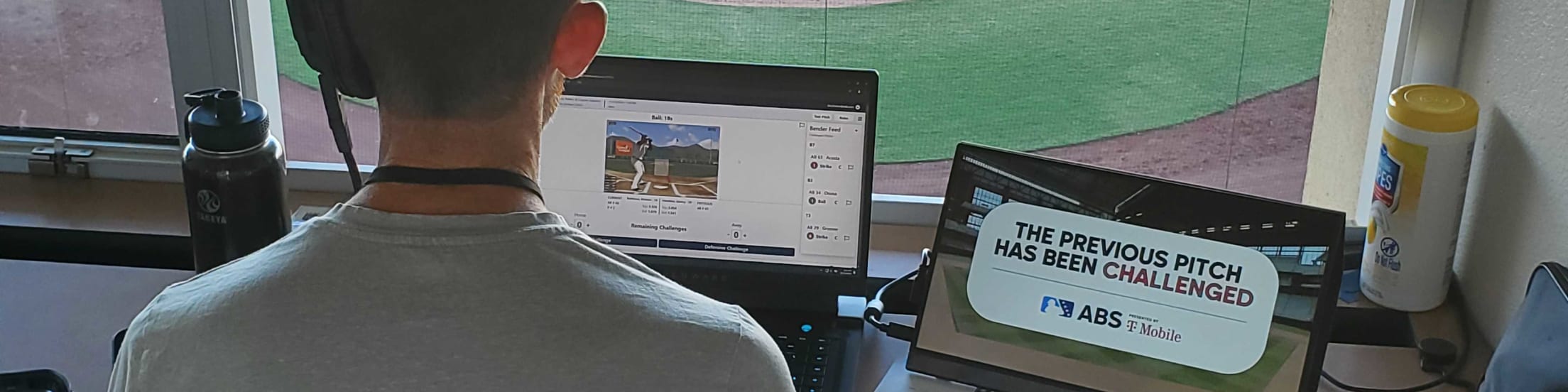 A photo of a man who works on ABS (automated ball and strikes) at MLB