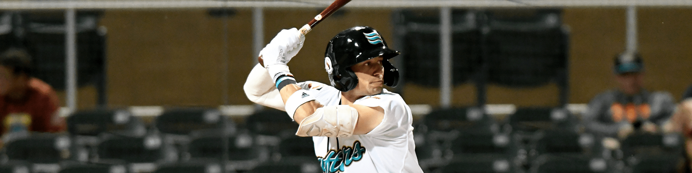 Royce Lewis, playing for the Salt River Rafters, stands in his batting stance at the plate in the Salt River home uniform