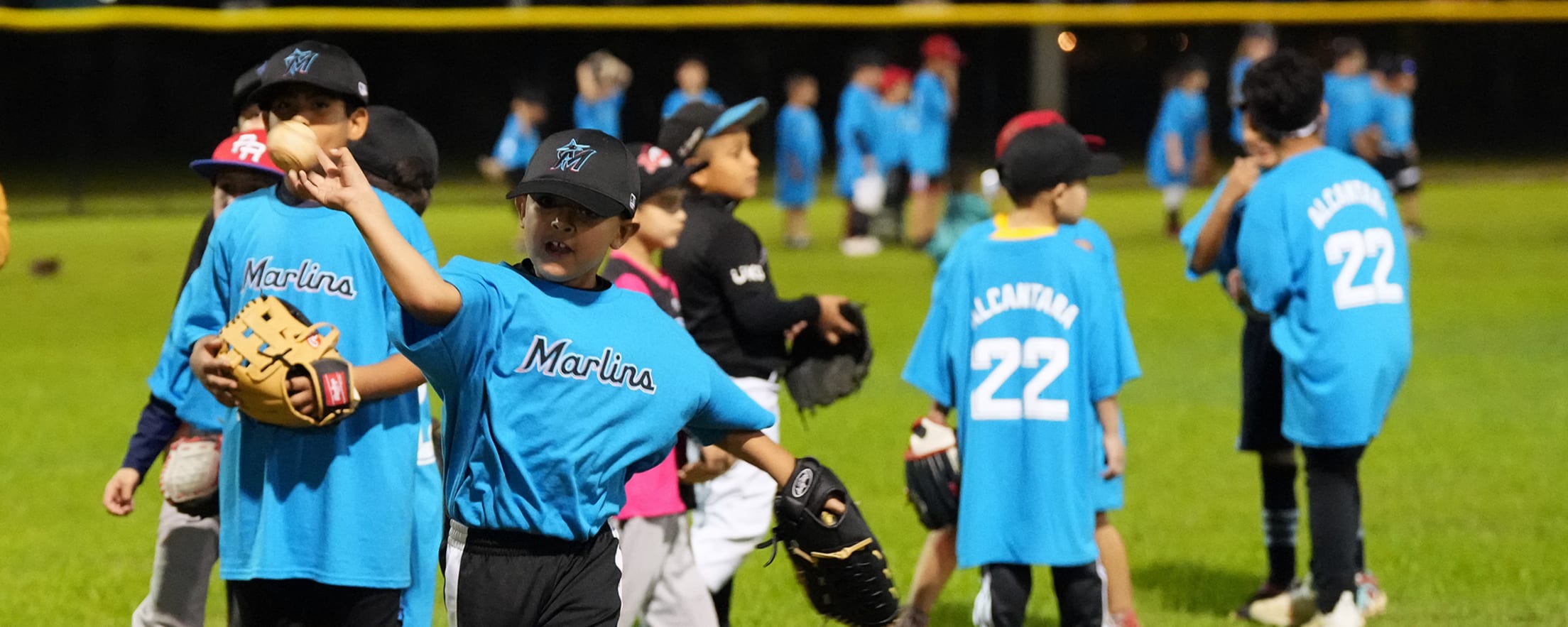 Children playing catch on the field