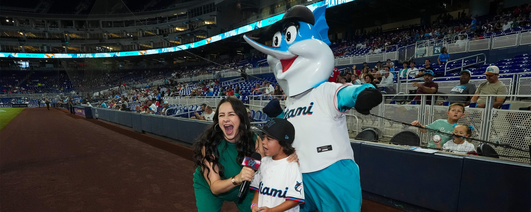 Fans announcing "Play Ball!" at a Marlins game