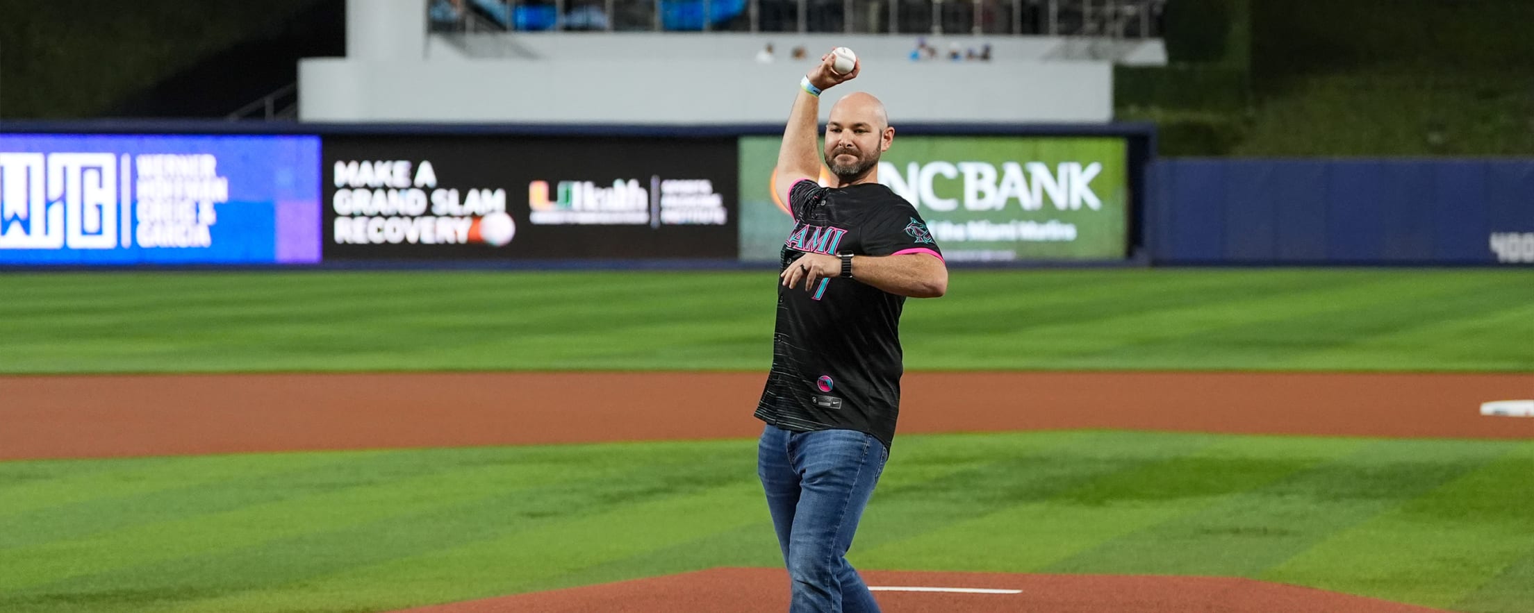 Fan throwing out the first pitch at a Marlins game