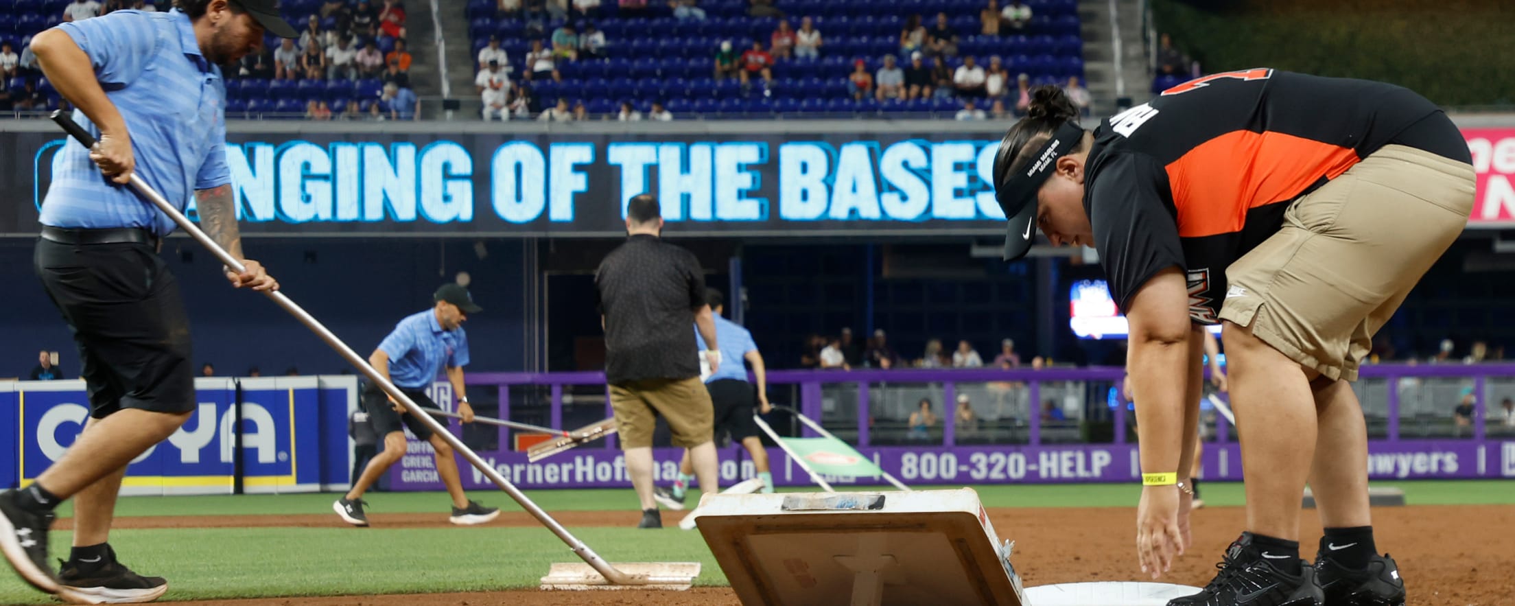 Fans changing the bases at loanDepot park