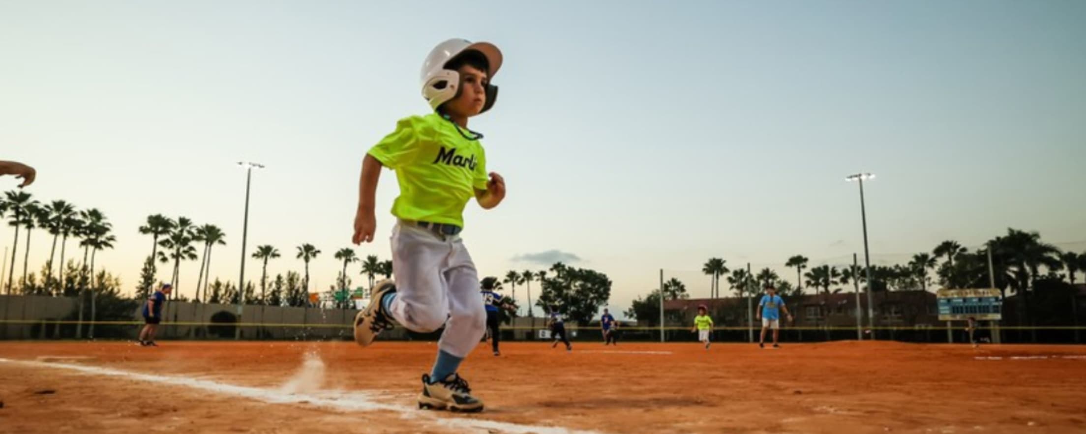 Tee ball player running the bases