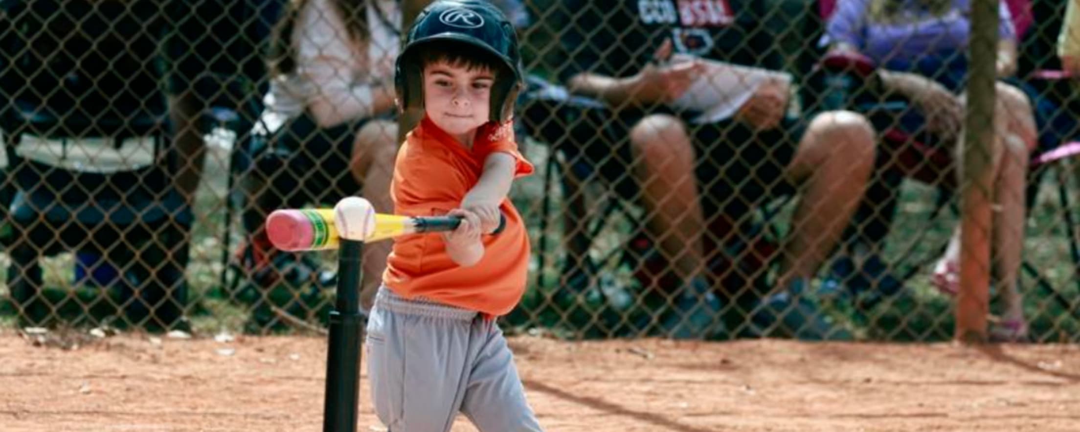 Tee ball player hitting