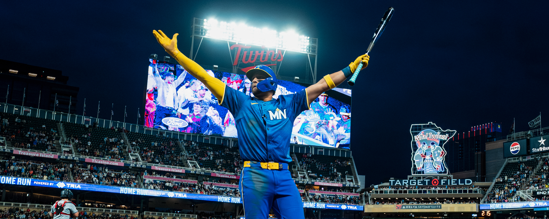 lights on at Target Field during an evening game