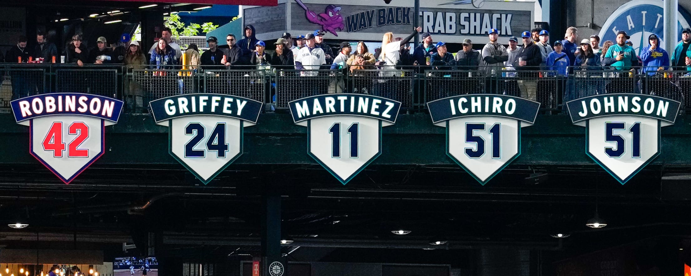 Mariners retired numbers featuring #42 Jackie Robinson, #24 Ken Griffey Jr., #11 Edgar Martinez, #51 Ichiro Suzuki and #51 Randy Johnson