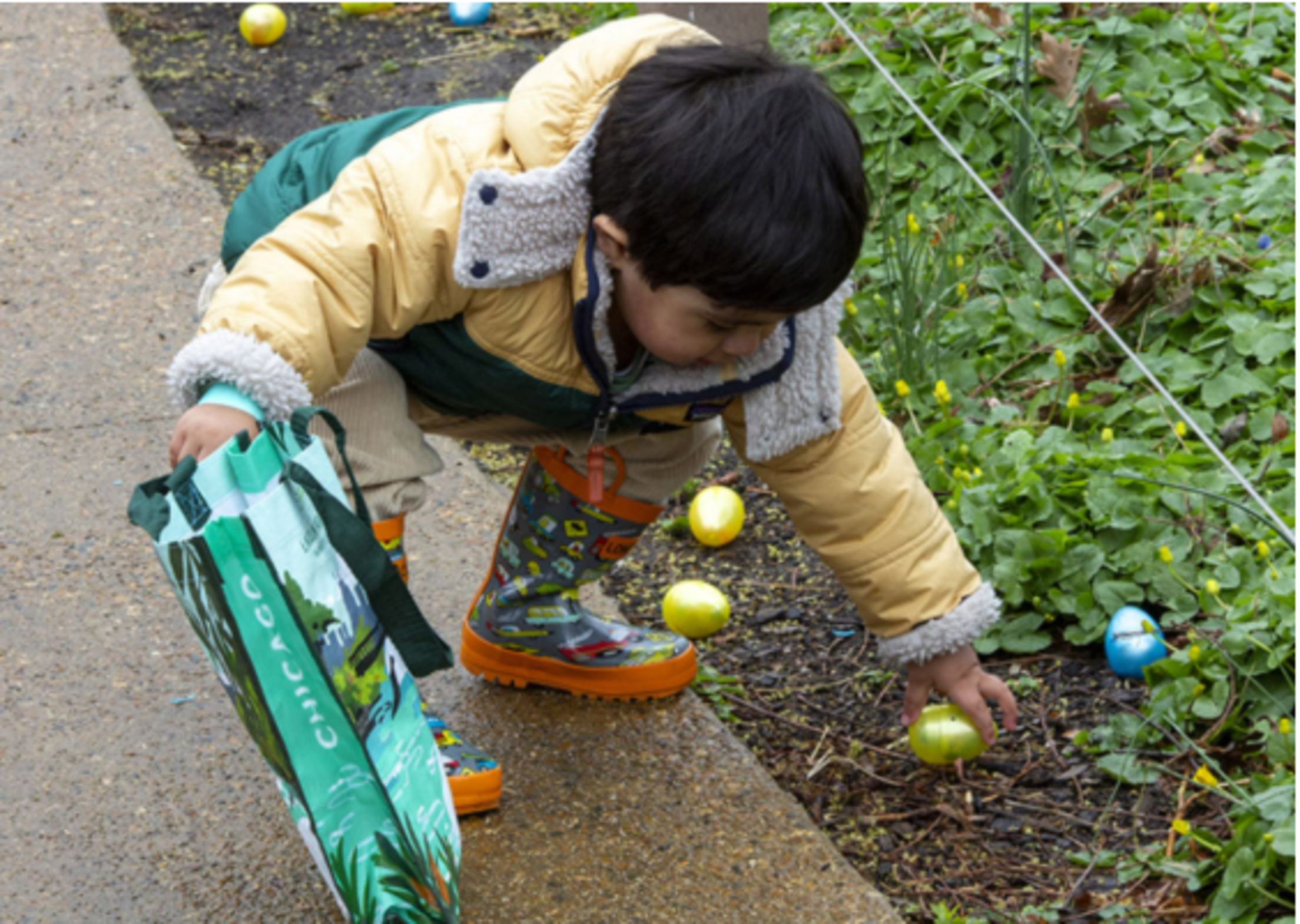 child-collecting-easter-eggs-garden