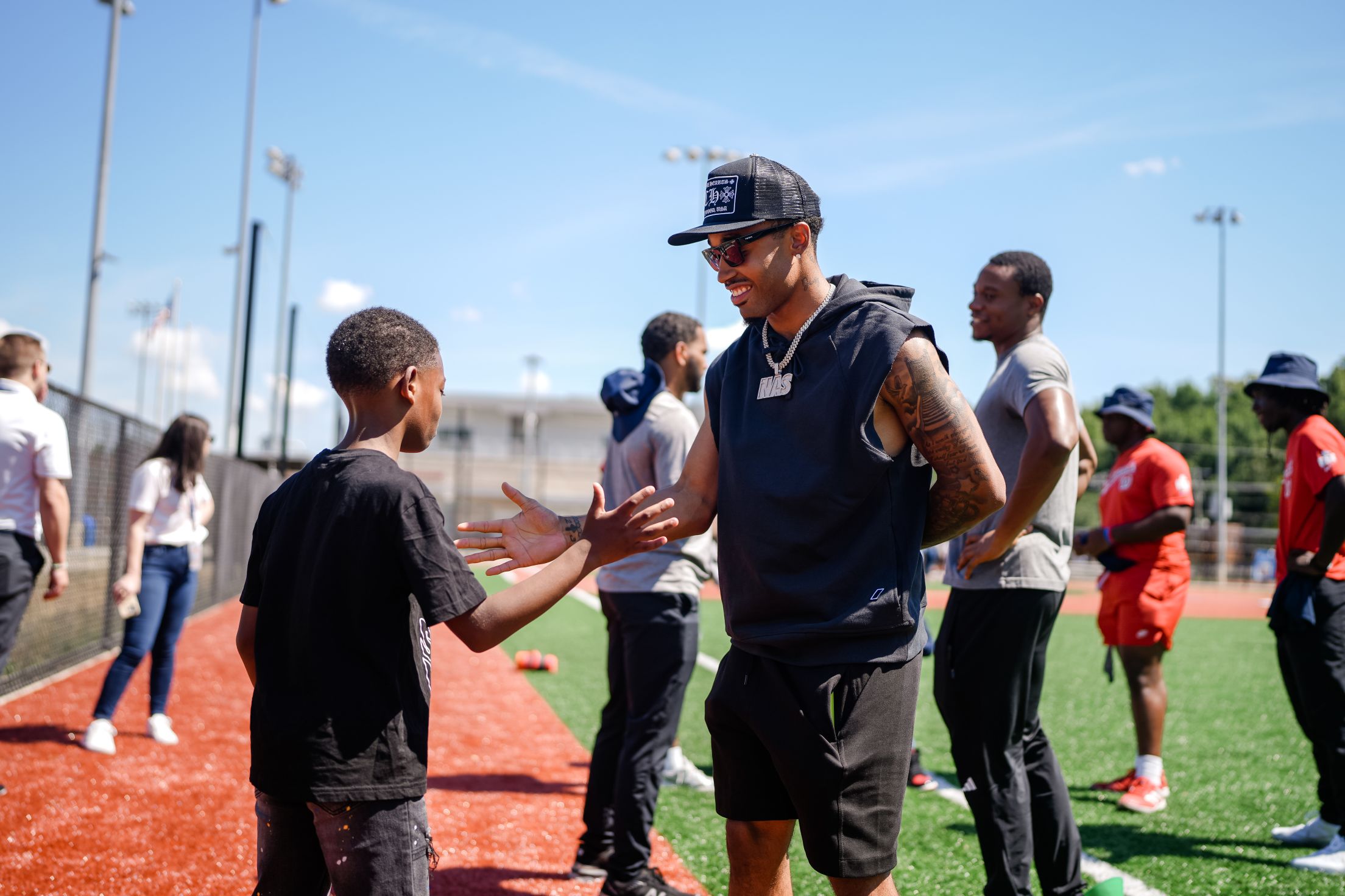 Nasim Nuñez interacts with a young player at the Nationals Youth Baseball Academy.