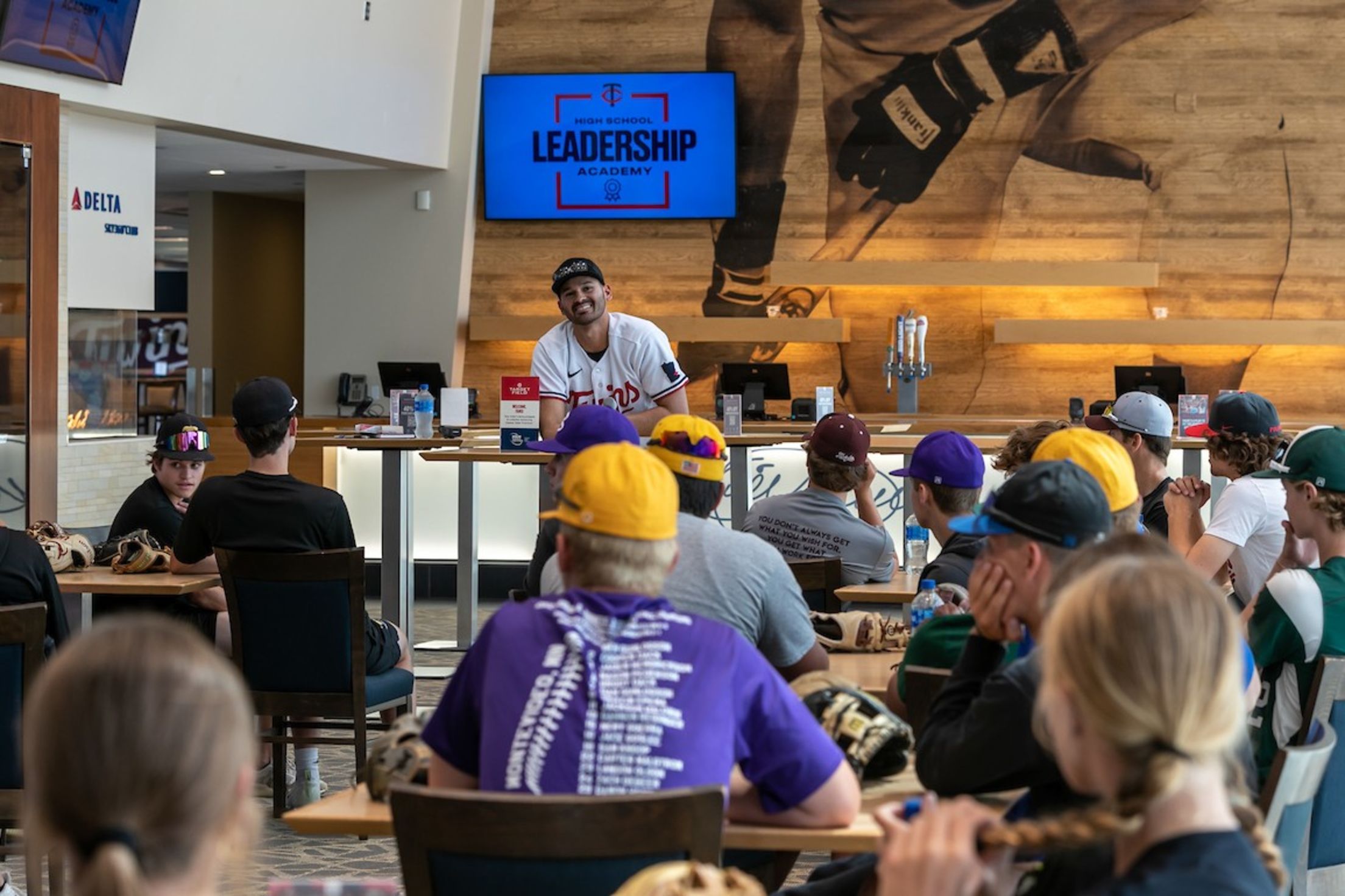 Pablo López joins youth baseball players at a leadership event.