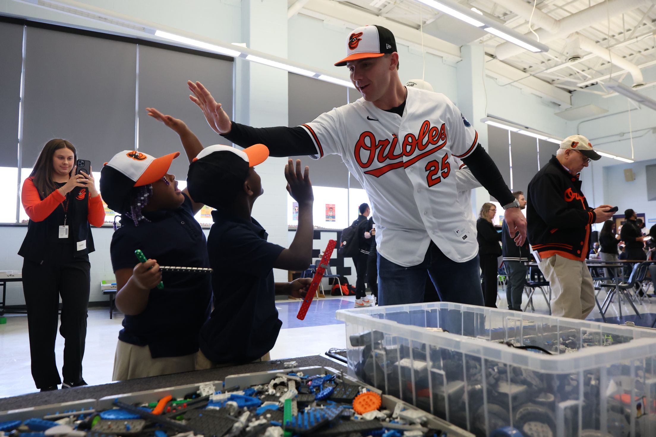 Pete Alonso high fives young Baltimore Orioles fans at an event.