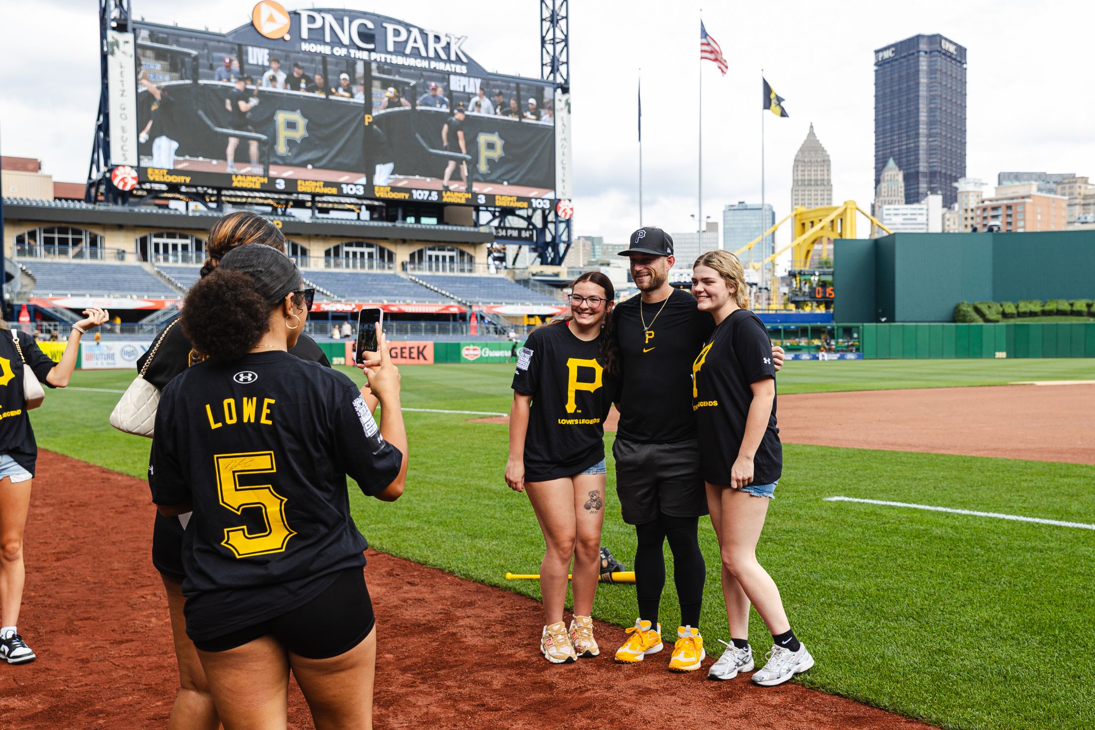 Brandon Lowe takes a photo with fans on the field at PNC Park.