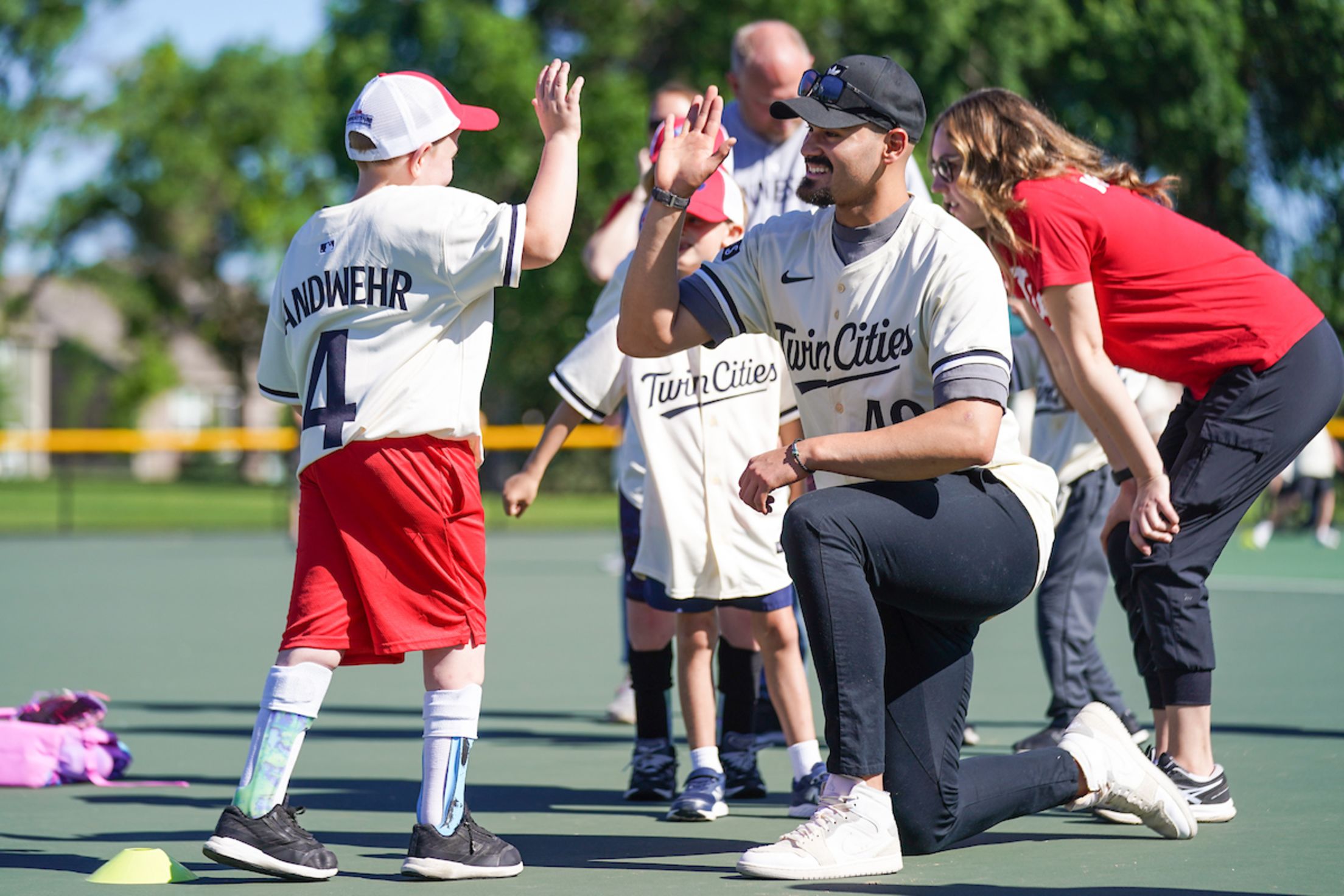 Pablo López high fives a fan as they participate in an event.