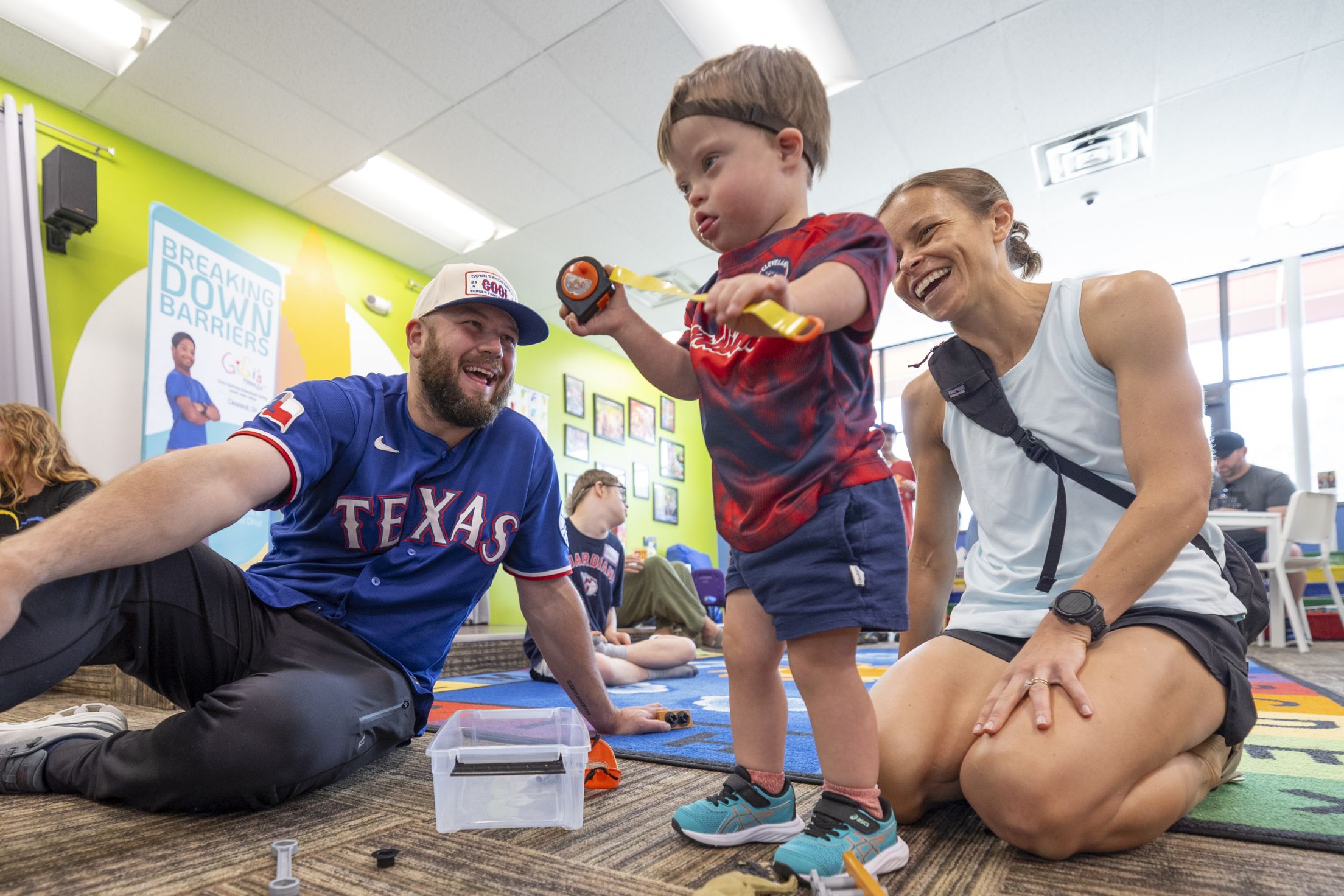 Jake Burger plays with a young child at Gigi's Playhouse.