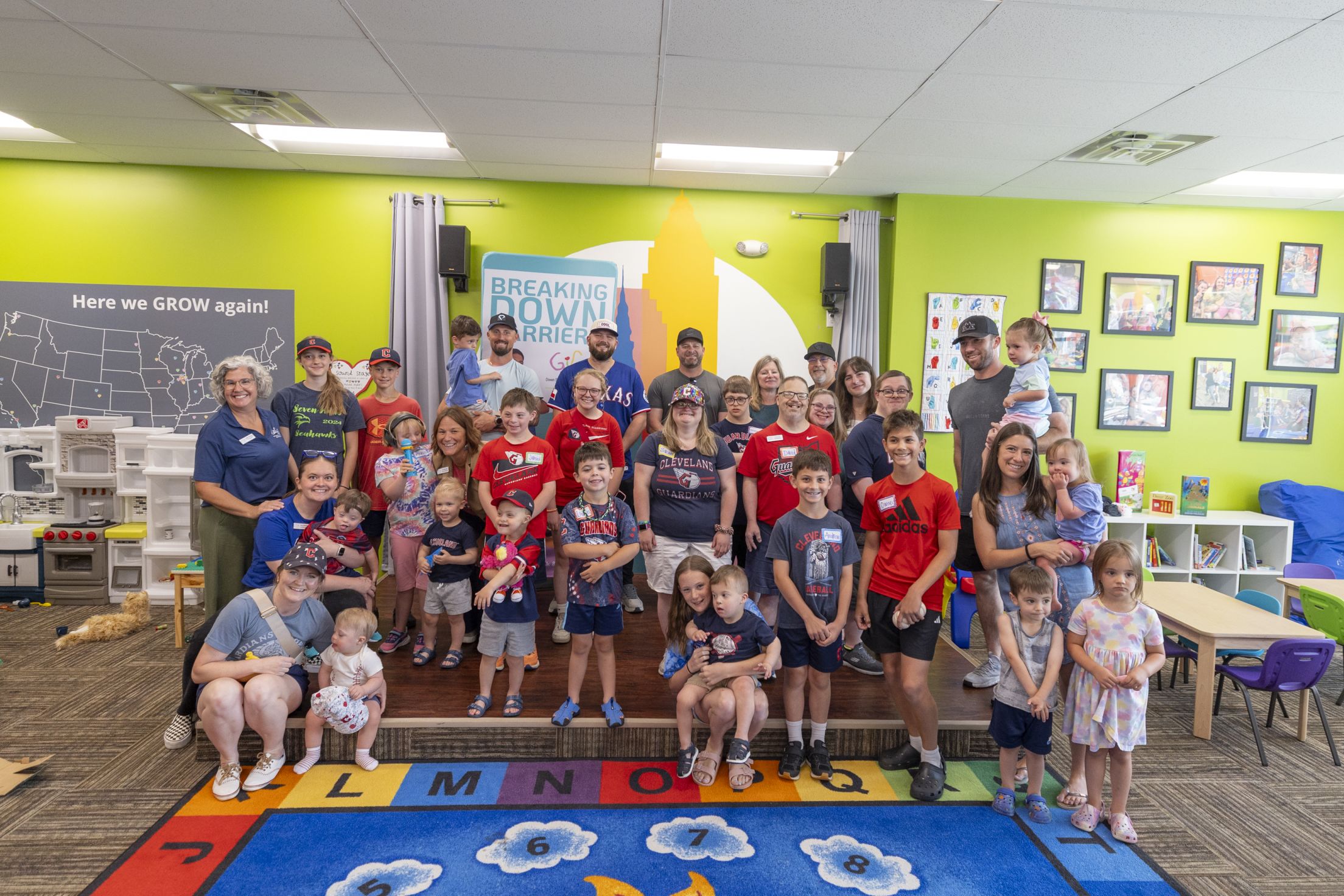 Jake Burger takes a group picture at Gigi's Playhouse.