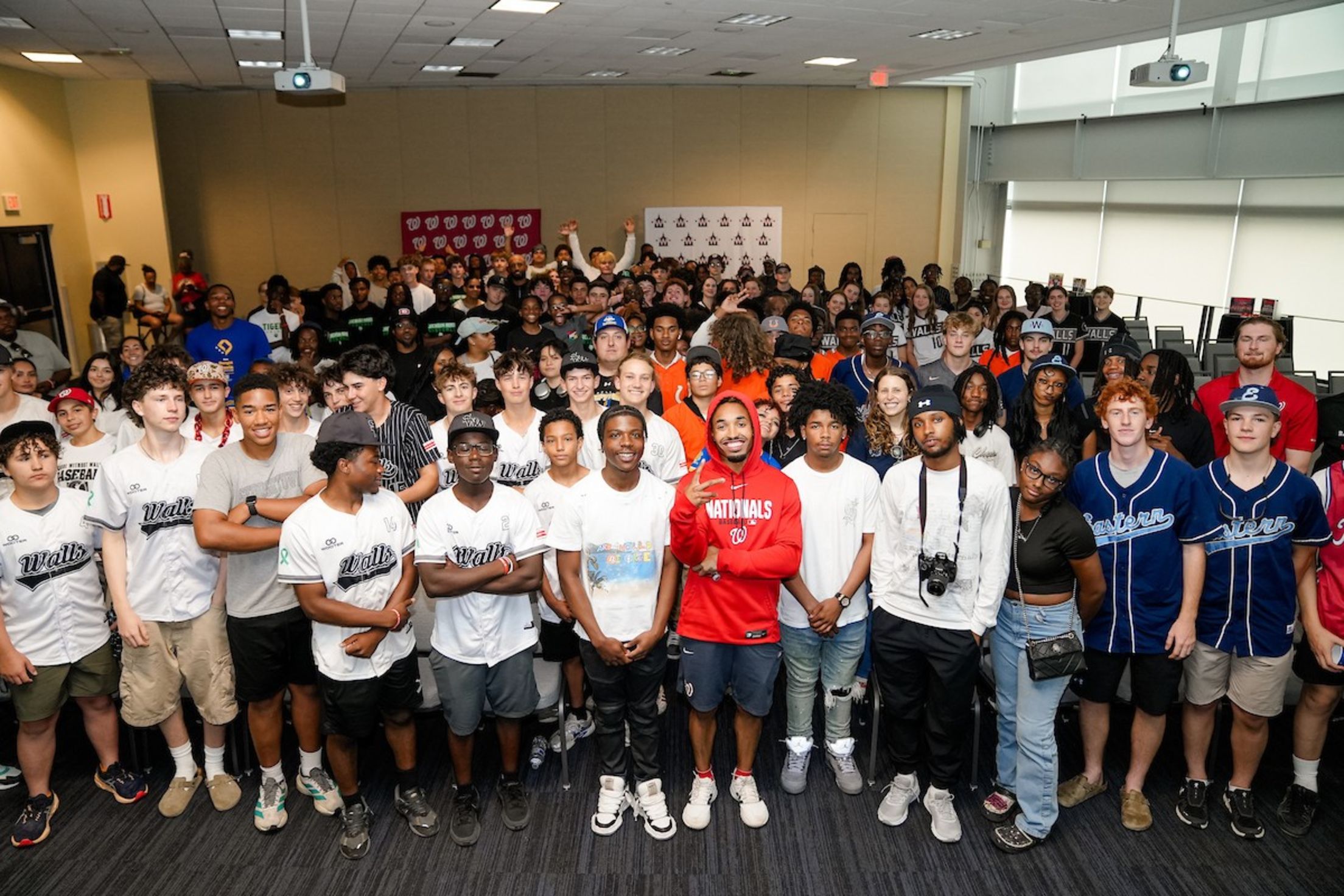 Nasim Nuñez takes a group photo with young adults from the District of Columbia Interscholastic Athletic Association (DCIAA).