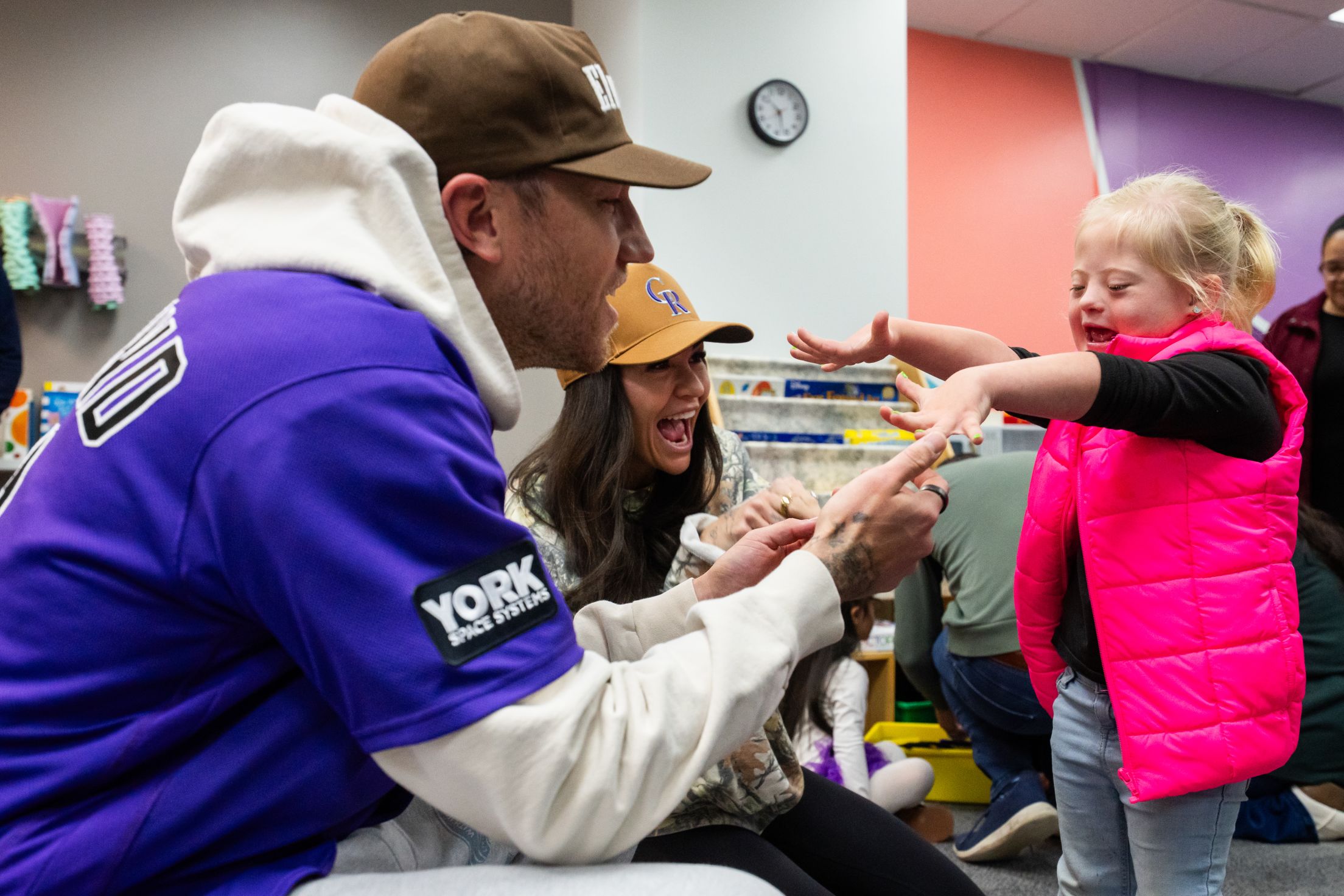 Kyle Freeland plays with a child at Gigi's Playhouse.