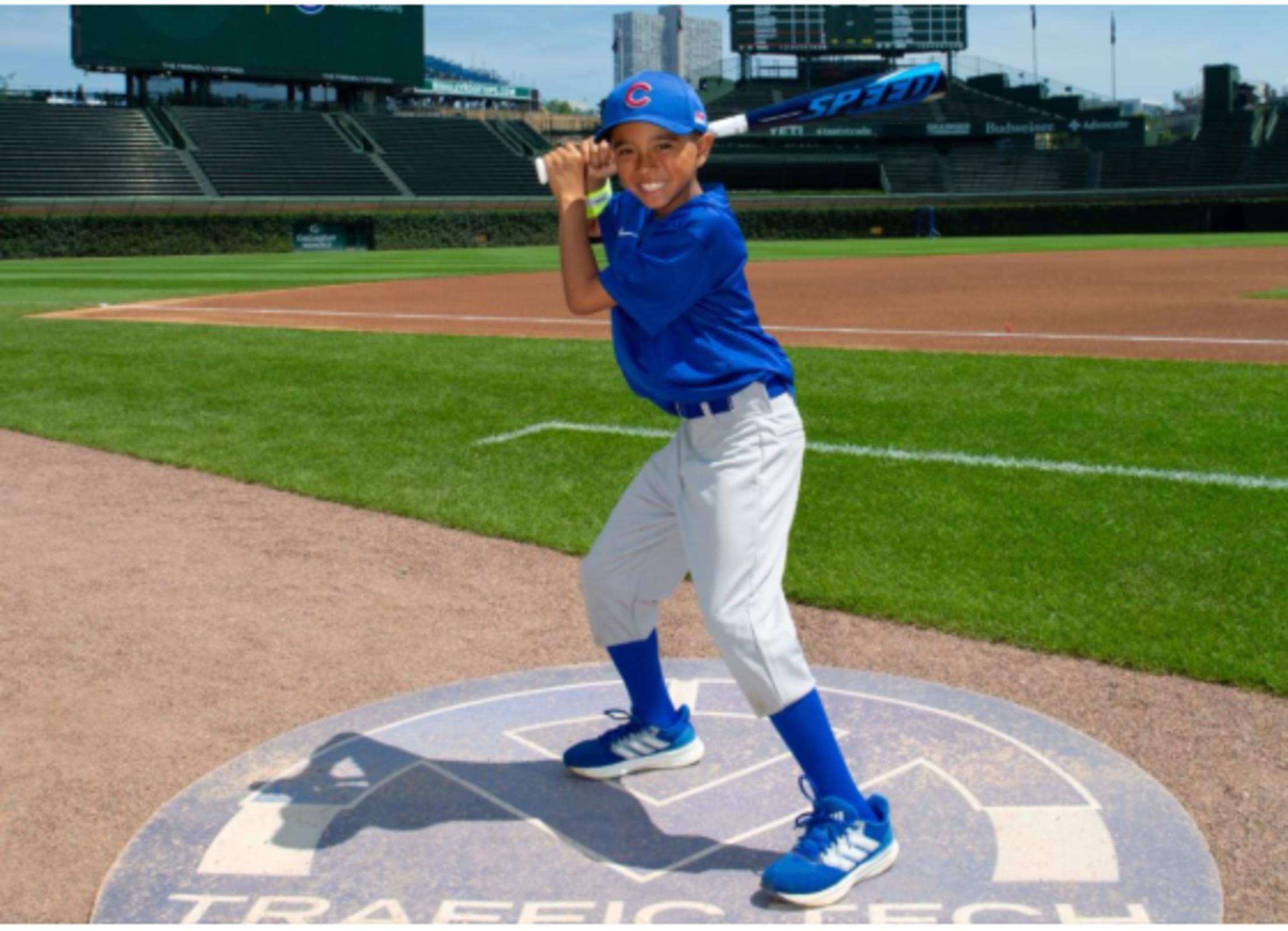 young-cubs-fan-batting-pose-wrigley-field