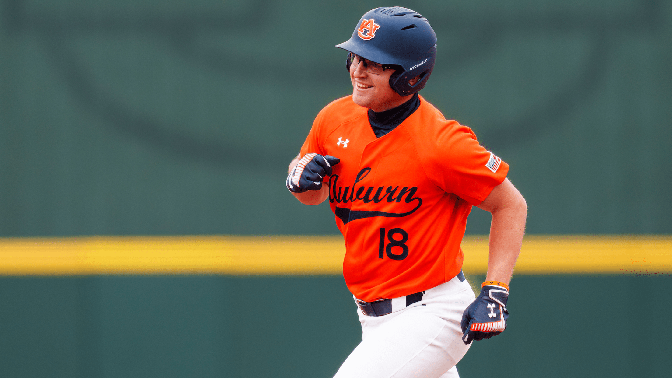 Auburn catcher Ike Irish rounds the bases with a smile.