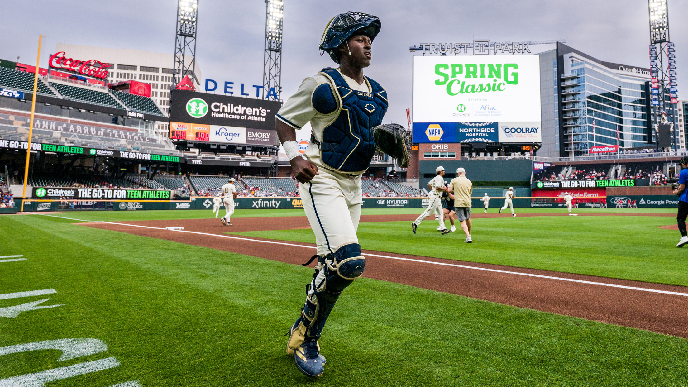 Georgia Tech catcher Vahn Lackey walks onto the field in full gear.