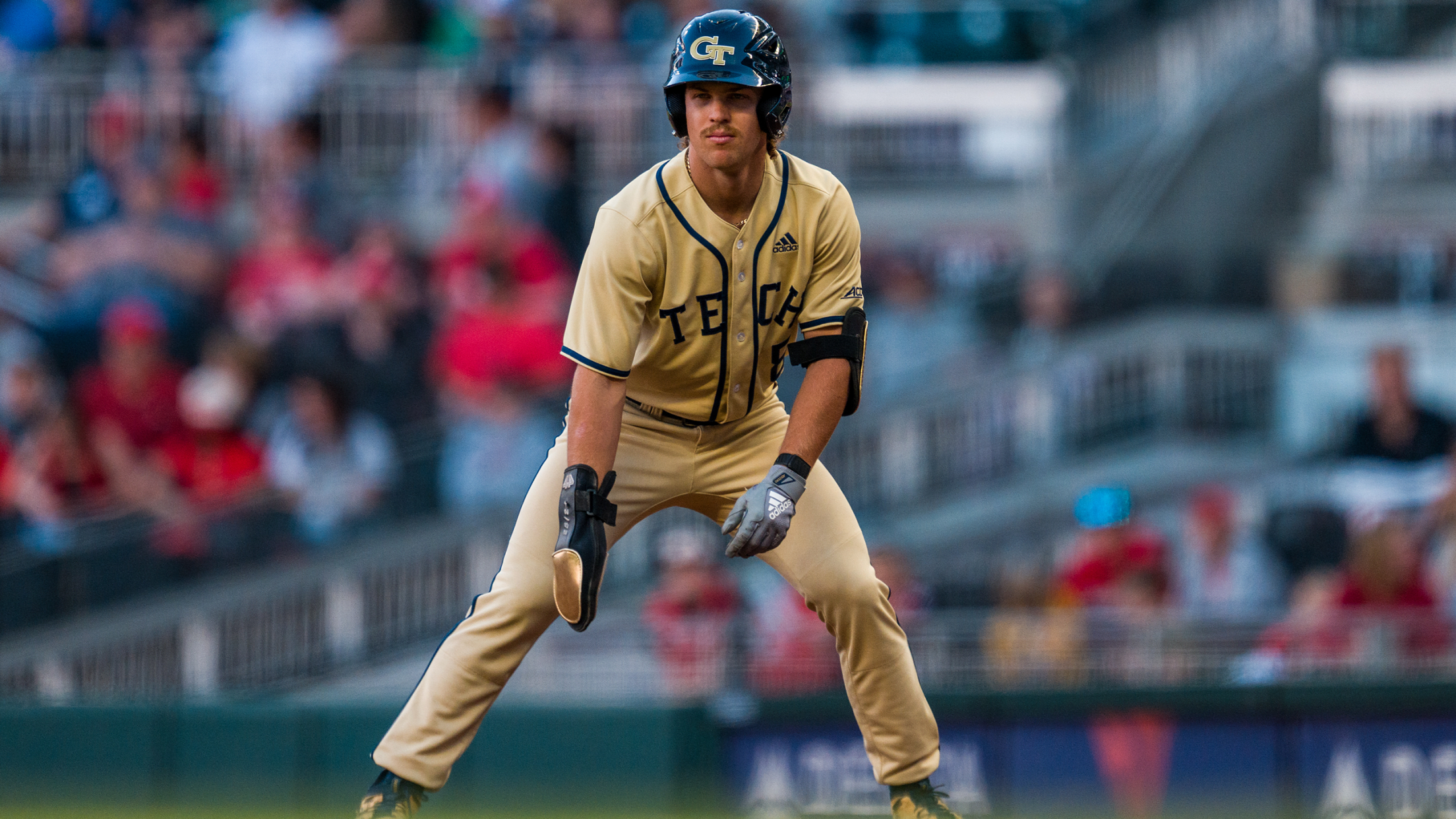 Georgia Tech outfielder Drew Burress takes a lead off first base while towards the pitcher